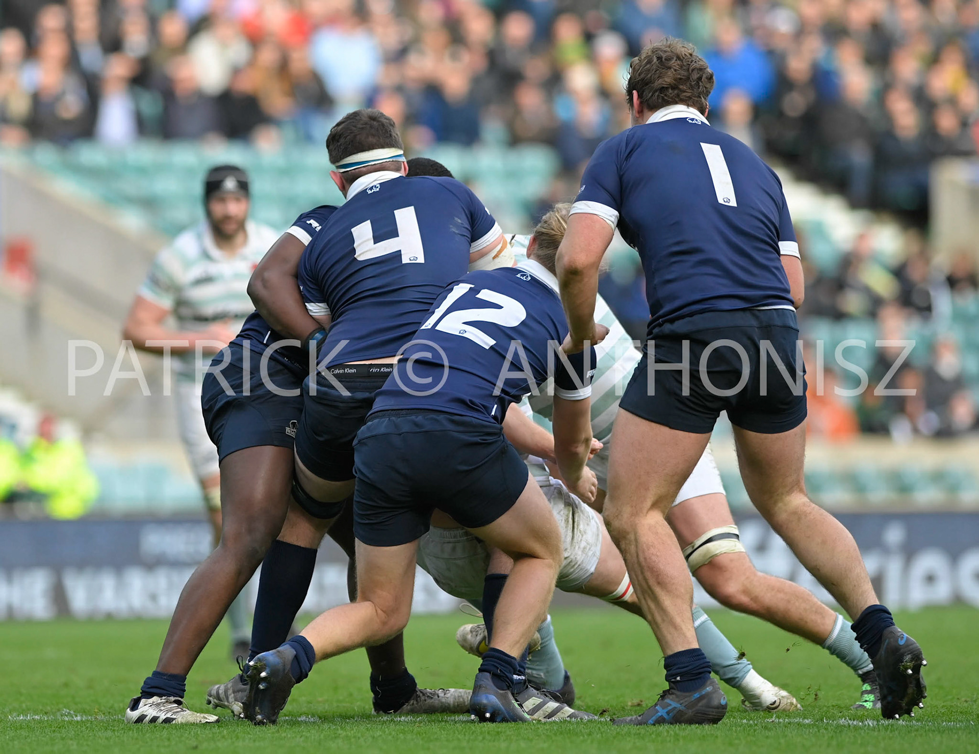 LONDON, ENGLAND March 25: no 1Tom Osborne (Trinity)  - Captain  no 12Liam Furniss (Kellogg)   and no 4 Ed Blake (St Hilda’s) of Oxford University  in action Oxford University vs Cambridge University Men's Varsity match at Twickenham Stadium on Saturday March 25-2023 in London, England.