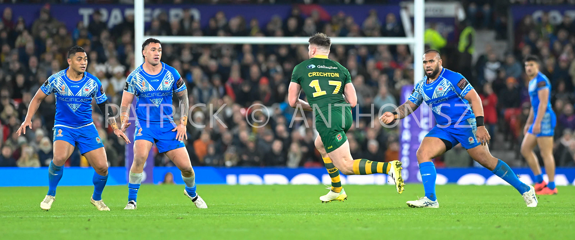 Manchester   ENGLAND - NOVEMBER 19. Angus Crichton of Australia tries to make a break from  Samoa defence during  the Rugby league World Cup Mens Final  between Australia and Samoa at the  Old Trafford   Stadium on November 19 - 2022 in Manchester England.