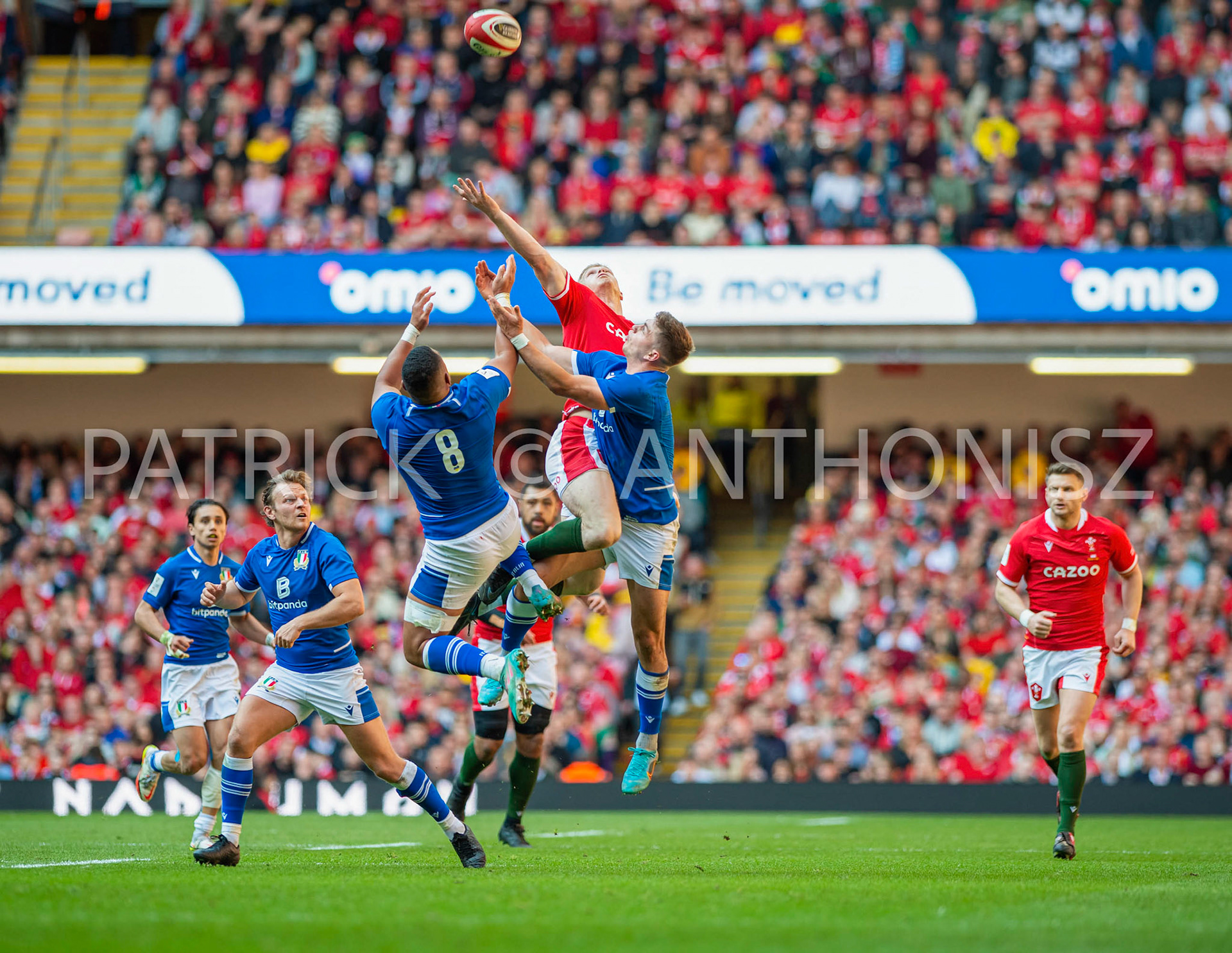 Wales v Italy Guinness Six Nations Cardiff, UK.19th Mar, 2022. Wales no 15 Johnny McNicholl goes for the ball ahead of Italy no 8 Toa Halafihi and Italy no 12 Leonardo Marin during the Guinness Six Nations Championship 2022 match, Wales v Italy at the Principality Stadium in Cardiff