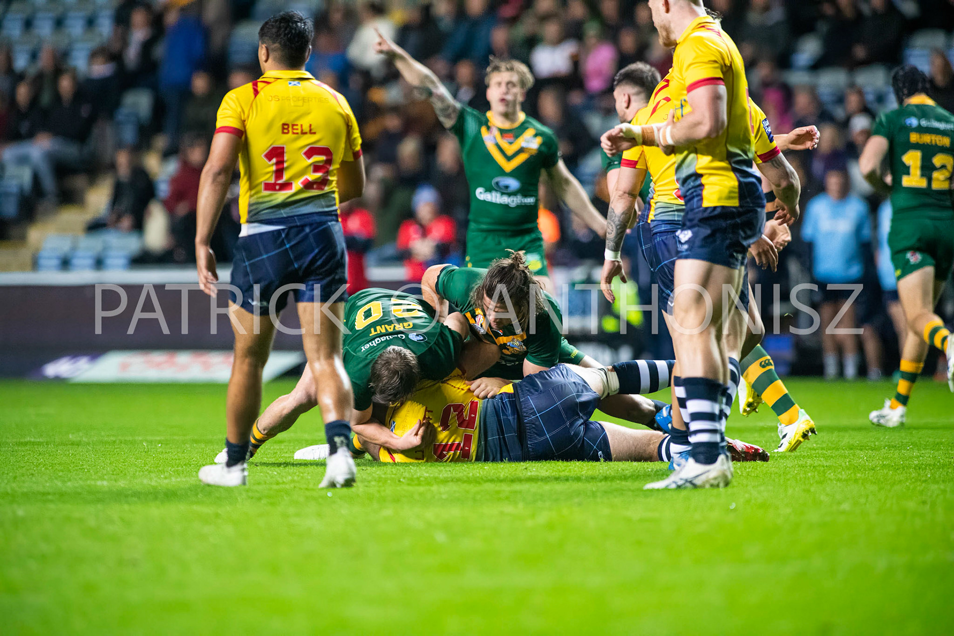 Coventry England  21st October:  Kane Linnett of Scotland is held by Harry Grant of Australia during the Rugby League World Cup 2021 between Australia Vs Scotland  at  Coventry Building Society Arena on 21st October 2022 Australia 84: Scotland 0