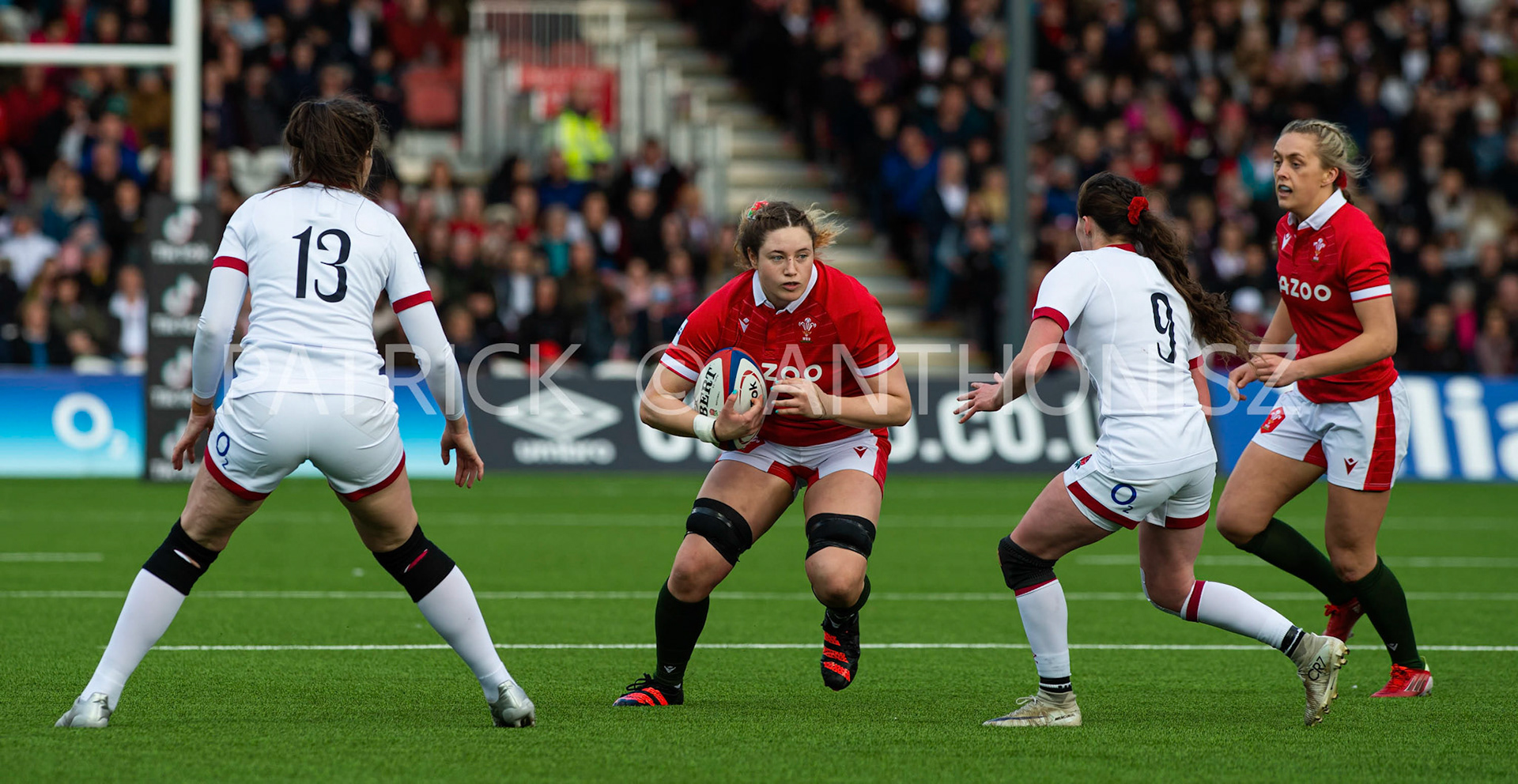England Vs Wales Six Nations Gloucester 9 April 2022.Gwen Crab of Wales tries to run away from no13 Emily Scarratt of England  and Lucy Packer of England  during the  TikTok Women's Six Nations Rugby Championship match, England Red Roses Vs Wales  Rugby at the Kingsholm  Stadium Gloucester