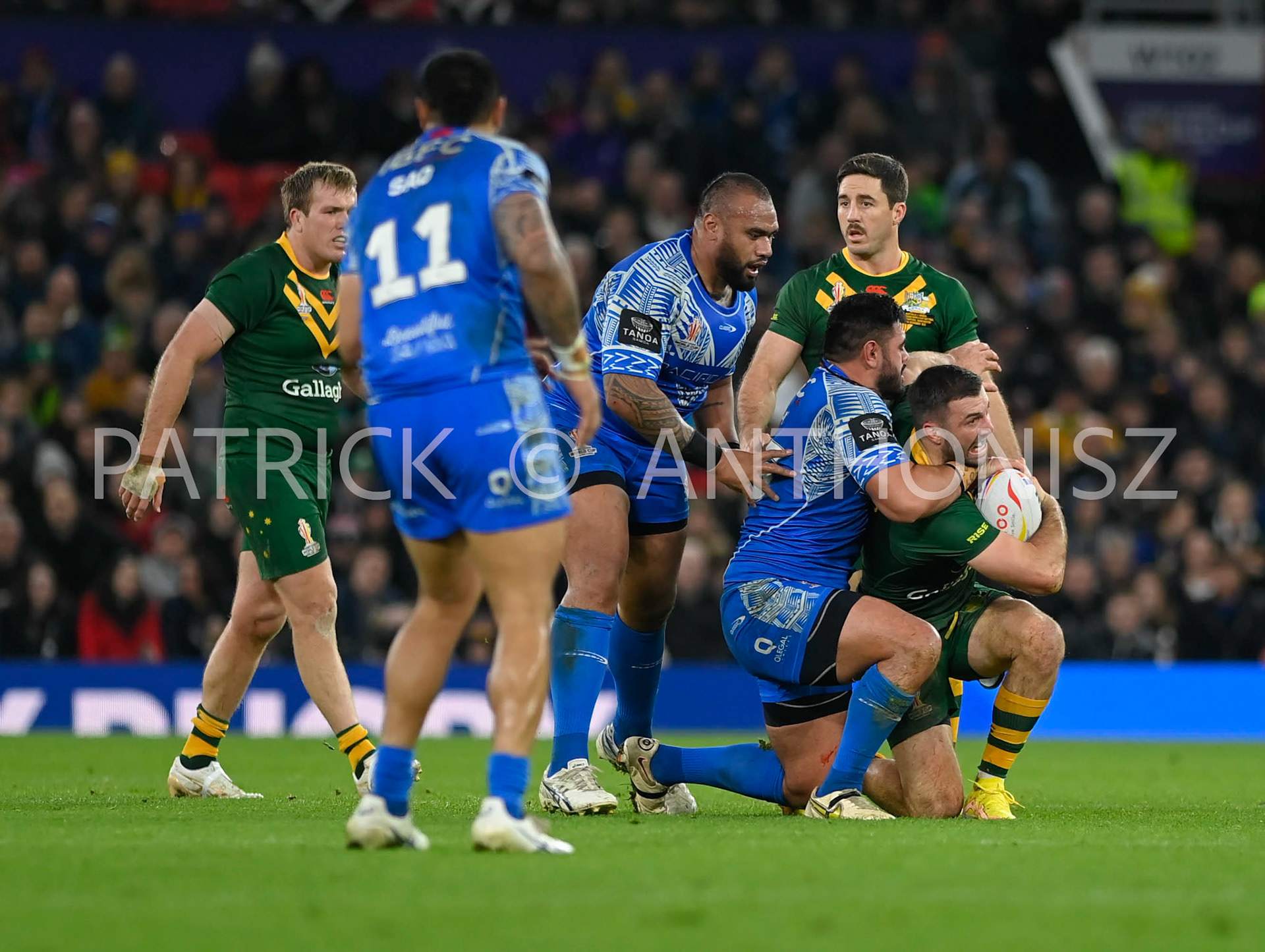 Manchester   ENGLAND - NOVEMBER 19.James Tedesco of Australia tries to keep the ball  during  the Rugby league World Cup Mens Final  between Australia and Samoa at the   Old Trafford Stadium on November 19 - 2022 in Manchester England.