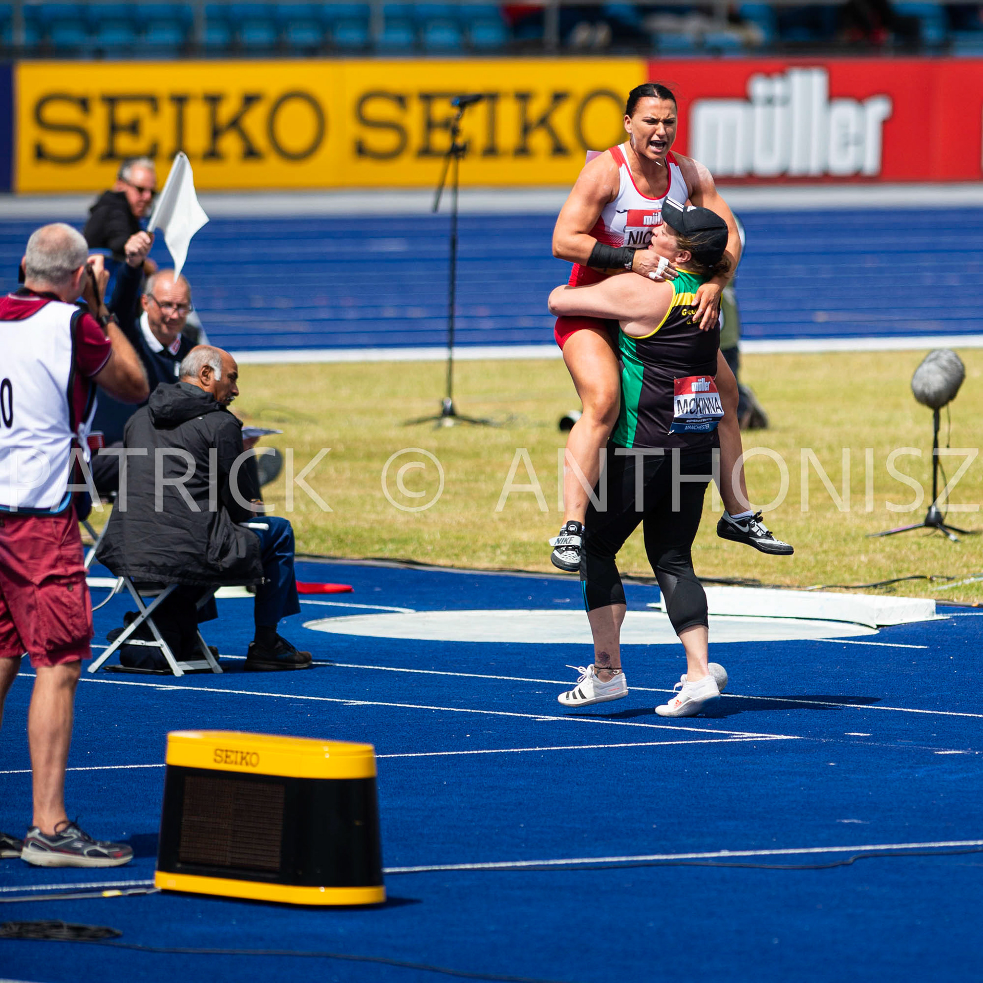 26-6-2022: Day 3  Women's Shot Put - Final  NICOLL Adele of  BIRCHFIELD HARRIERS celebrate the winning throw of 17.59 with MCKINNA Sophie of  GREAT YARMOUTH &amp; DISTRICT at the Muller UK Athletics Championships MANCHESTER REGIONAL ARENA – MANCHESTER 2022     NICOLL Adele of  BIRCHFIELD HARRIERS celebrate the winning throw of 17.59 with MCKINNA Sophie  GREAT YARMOUTH &amp; DISTRICT