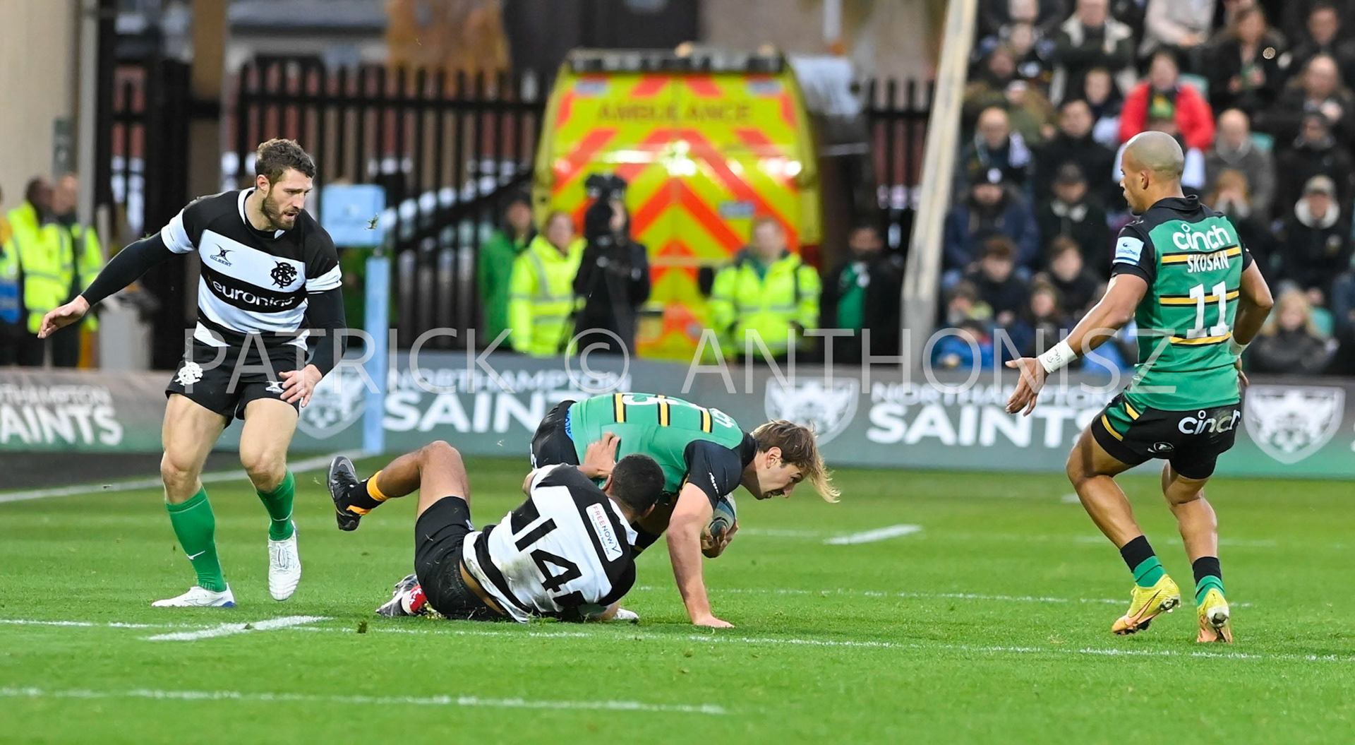 NORTHAMPTON, ENGLAND- Nov -26 - 2022 :  James Rammof Northampton Saints is taken down by ZACHKIBIRIGE of Barbarians   during the match between Northampton Saints and The Barbarians F C at Franklin's Gardens on November 26, 2022 in Northampton, England