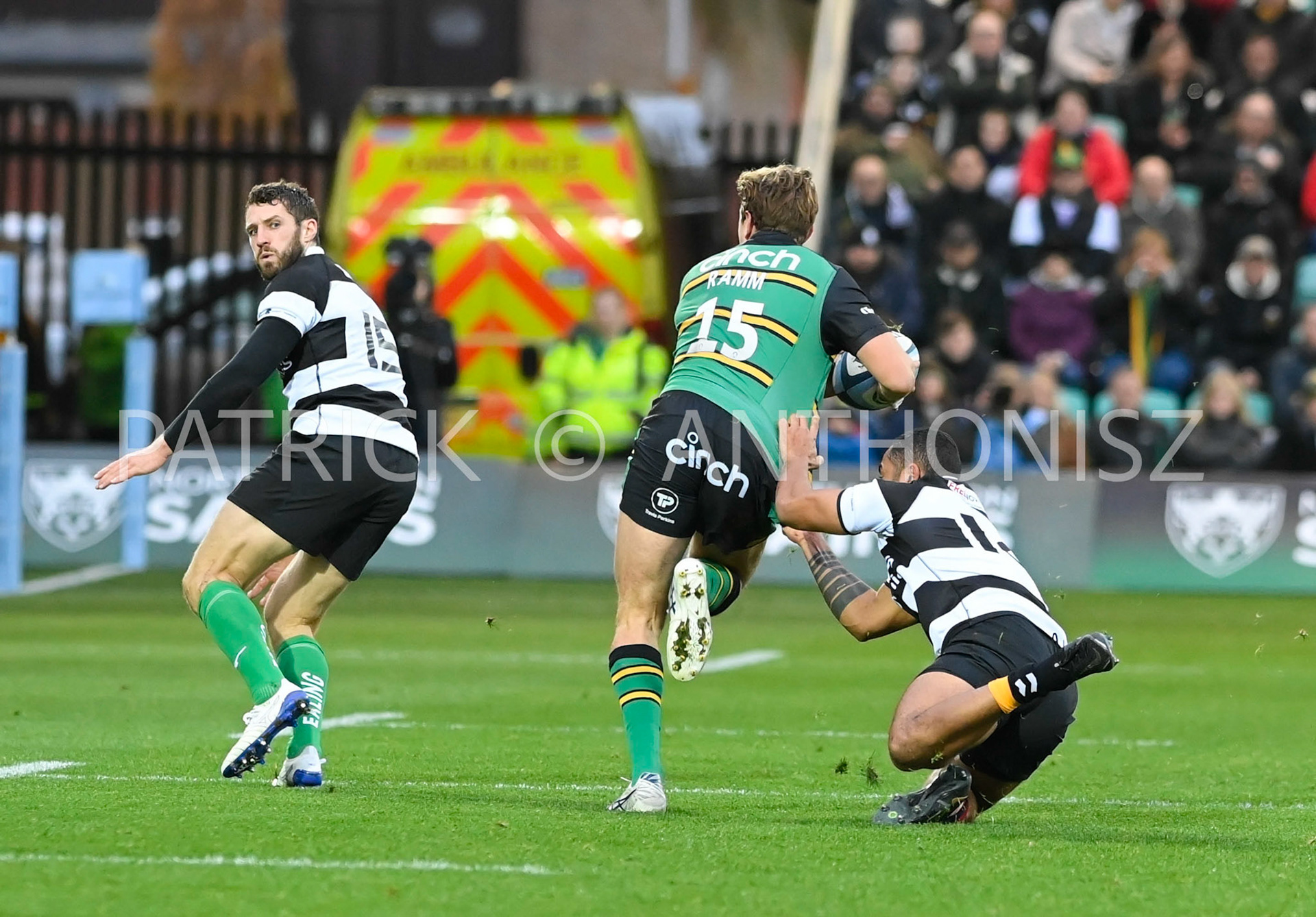 NORTHAMPTON, ENGLAND- Nov -26 - 2022 :  James Rammof Northampton Saints is taken down by ZACHKIBIRIGE of Barbarians   during the match between Northampton Saints and The Barbarians F C at Franklin's Gardens on November 26, 2022 in Northampton, England