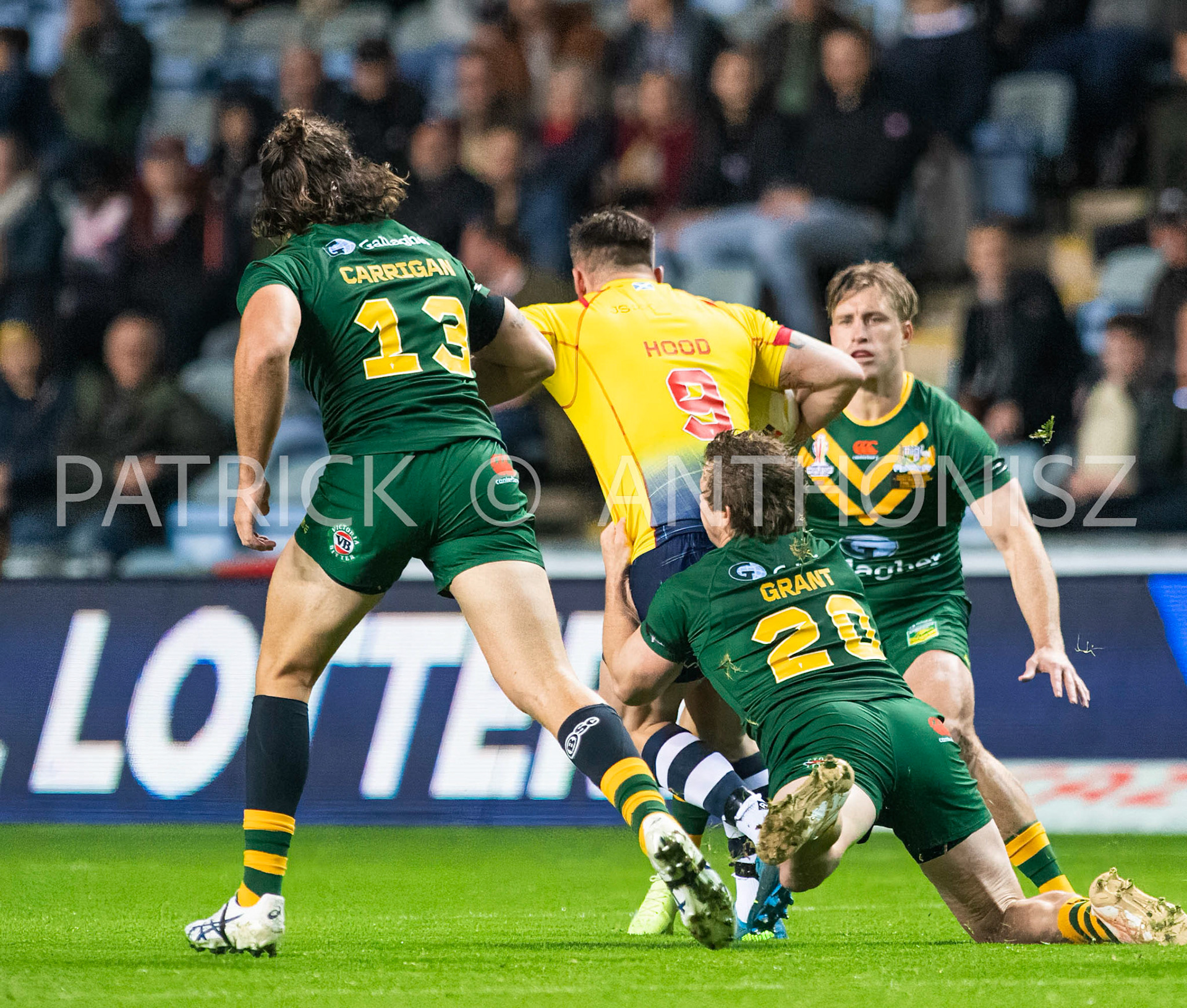 Coventry England  21st October: Liam Hood of Scotland is held by Harry Grant of Australia  during the Rugby League World Cup 2021 between Australia Vs Scotland  at  Coventry Building Society Arena on 21st October 2022 Australia 84: Scotland 0