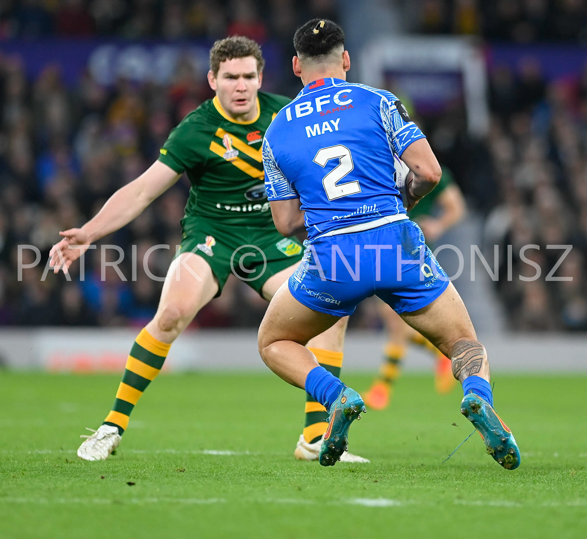 Manchester   ENGLAND - NOVEMBER 19.Taylan May of Samoa tries to break away from  Liam Martin of Australia during  the Rugby league World Cup Mens Final  between Australia and Samoa at the  Stadium  Old Trafford on November 19 - 2022 in Manchester England.