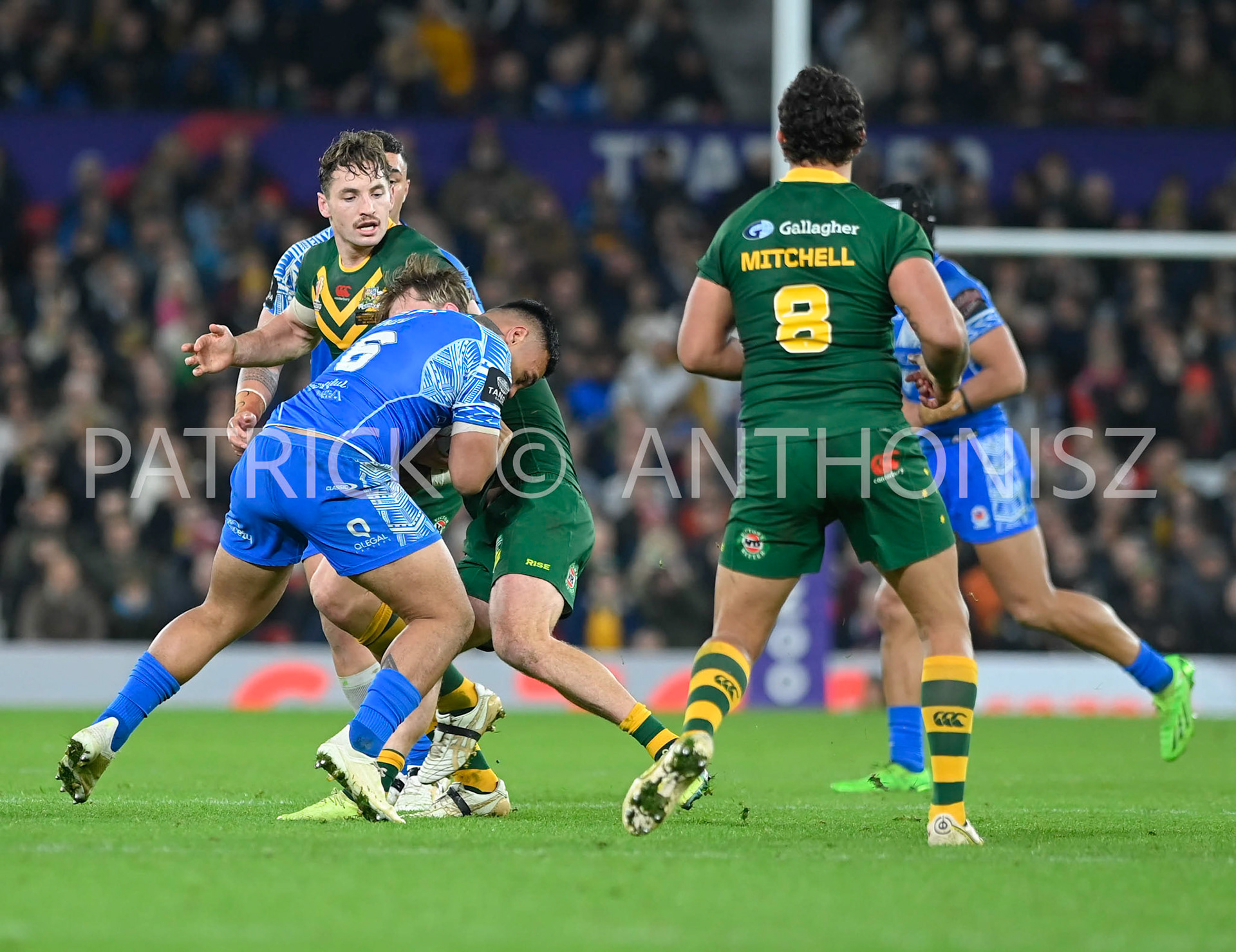 Manchester   ENGLAND - NOVEMBER 19. Spencer Leniu of Samoa tries to keep the ball from the Australia defence during  the Rugby league World Cup Mens Final  between Australia and Samoa at the   Old Trafford Stadium on November 19 - 2022 in Manchester England.