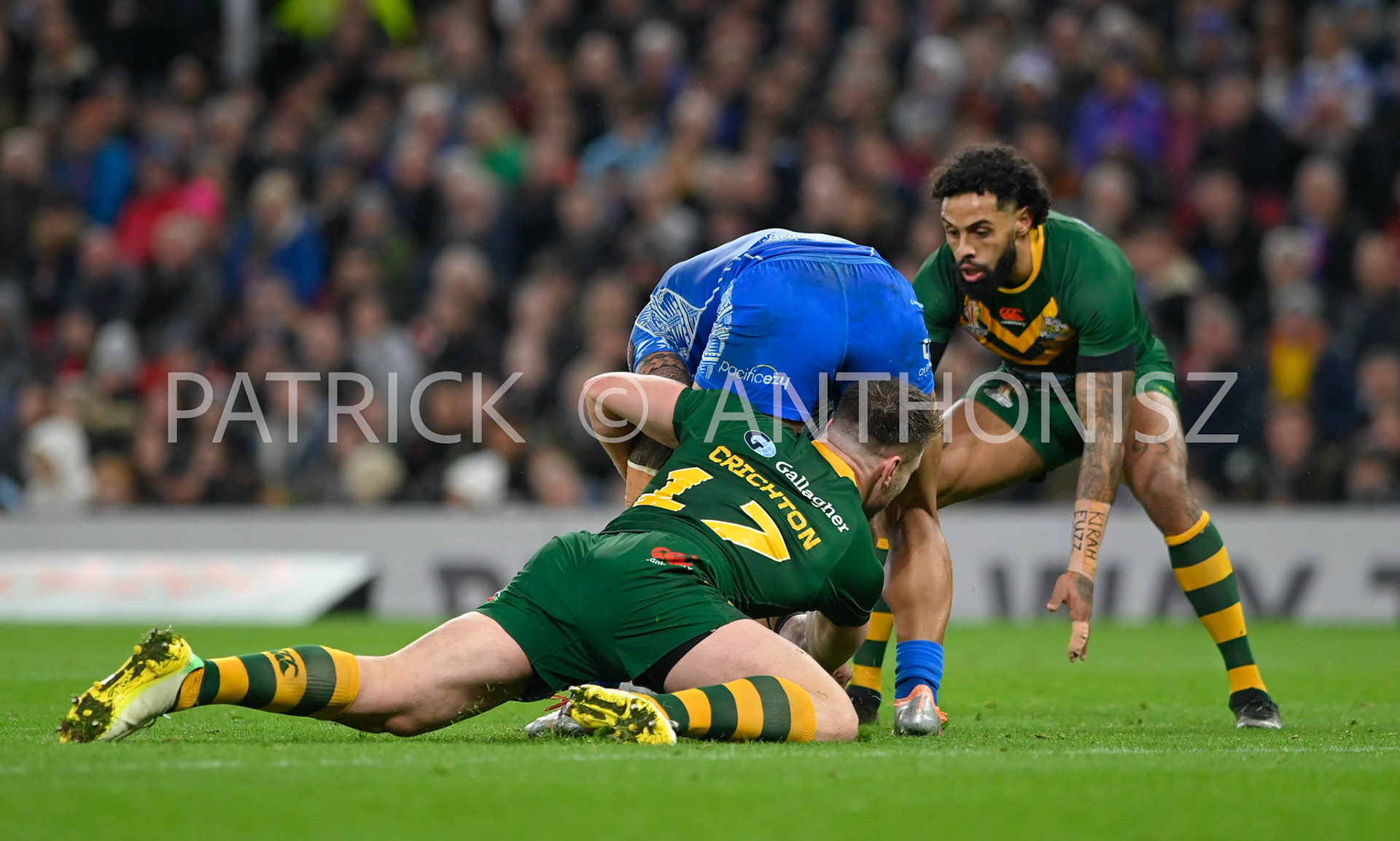 Manchester   ENGLAND - NOVEMBER 19. Angus Crichton of Australia stops Brian To'o of Samoa during  the Rugby league World Cup Mens Final  between Australia and Samoa at the   Old TraffordStadium on November 19 - 2022 in Manchester England.