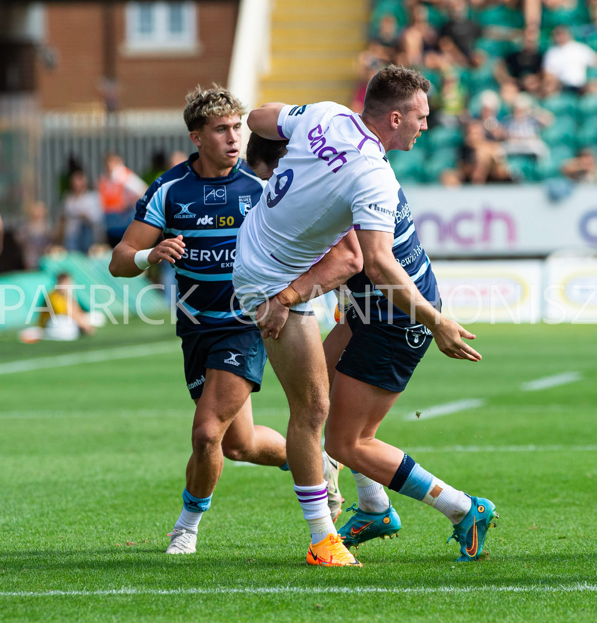 NORTHAMPTON, ENGLAND - August 27 : 2022  Tom James  is brought down  during the match between Northampton Saints and Bedford Blues   at Franklin's Gardens on August 27  2022 in Northampton, England.