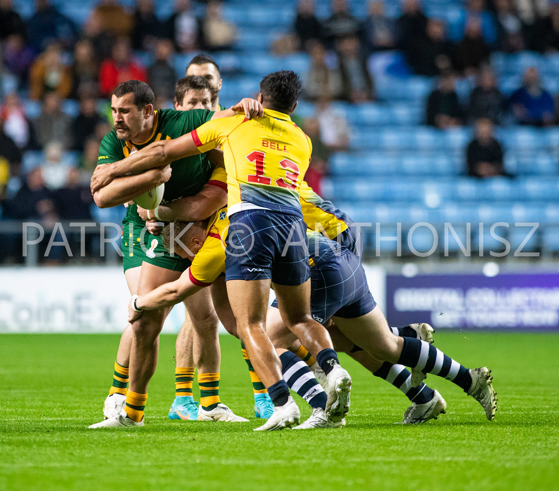 Coventry England  21st October:  Reagan Campbell-Gillard of Australia is held by James Bell of Scotland during the Rugby League World Cup 2021 between Australia Vs Scotland  at  Coventry Building Society Arena on 21st October 2022 Australia 84: Scotland 0