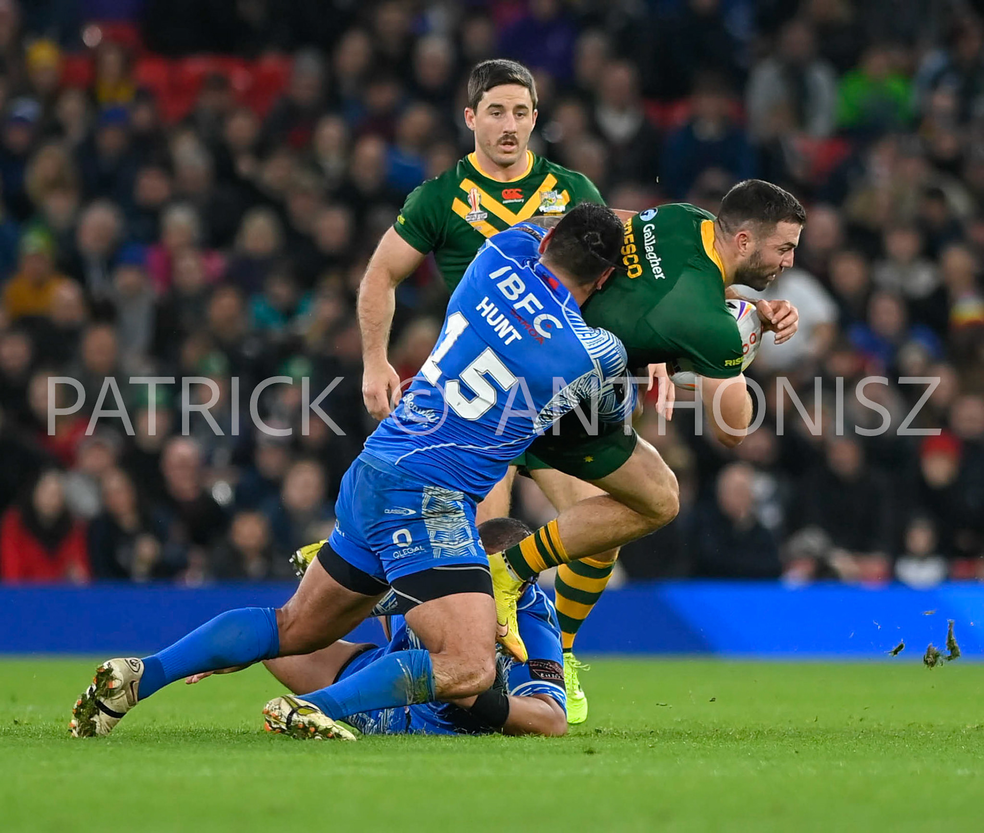 Manchester   ENGLAND - NOVEMBER 19.Royce Hunt of Samoa takes  down James Tedesco of Australia during  the Rugby league World Cup Mens Final  between Australia and Samoa at the  Old Trafford Stadium on November 19 - 2022 in Manchester England.