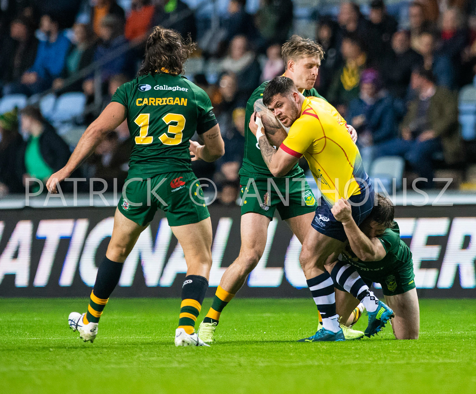 Coventry England  21st October: Liam Hood of Scotland is held by Harry Grant of Australia  during the Rugby League World Cup 2021 between Australia Vs Scotland  at  Coventry Building Society Arena on 21st October 2022 Australia 84: Scotland 0