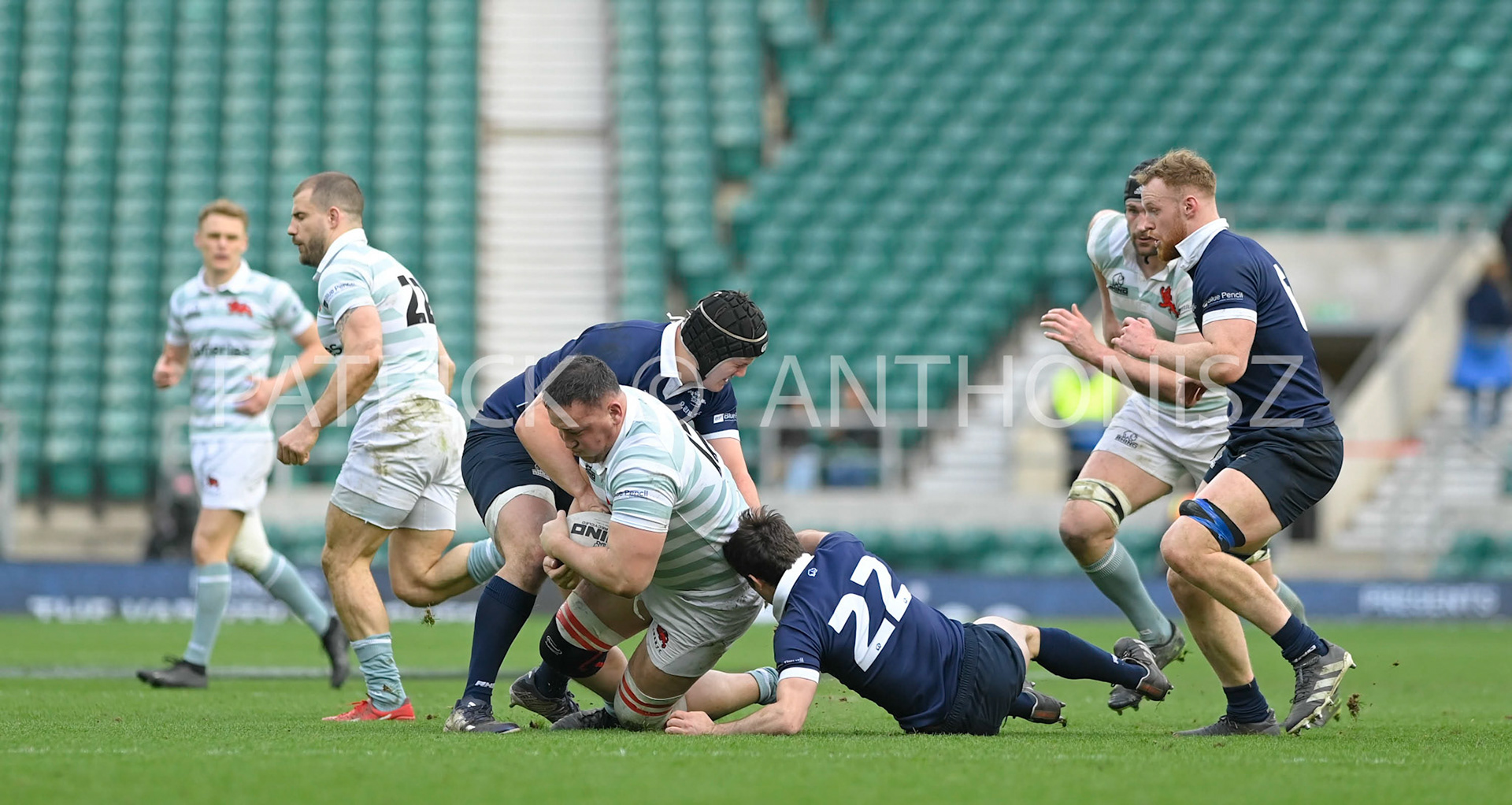 LONDON, ENGLAND March 25: :Danny Collins (Fitzwilliam) of Cambridge University tries to break away from no 22 :Xander Jackman of  Oxford University University during the match between  Oxford University vs Cambridge University Men's Varsity match at Twickenham Stadium on Saturday March 25-2023 in London, England.
