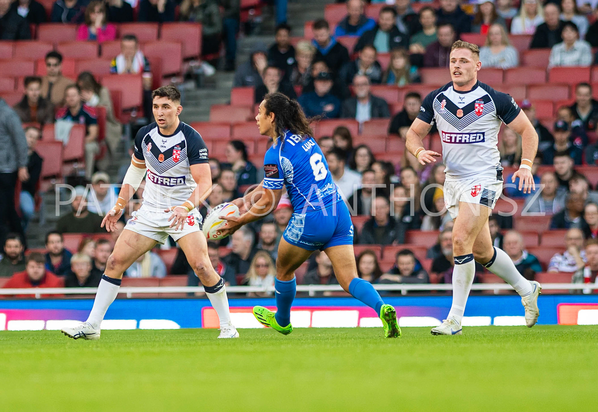 London  ENGLAND - NOVEMBER 12. Jarome Luai of Samoa passes the ball during  the  Semi Final between England and Samoa at the Emirates Stadium on November 12 - 2022 in London, England.