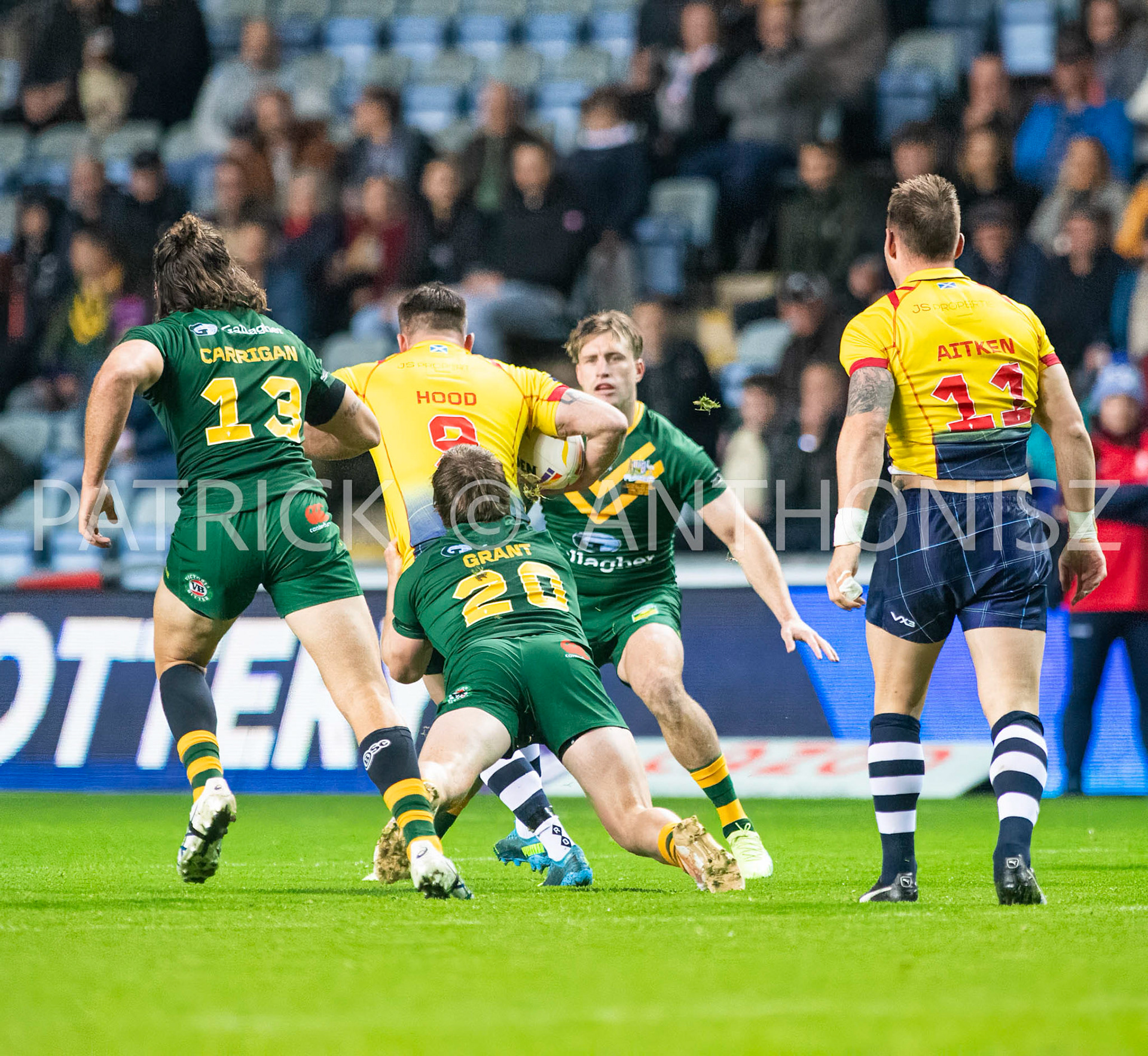 Coventry England  21st October: Liam Hood of Scotland is held by Harry Grant of Australia  during the Rugby League World Cup 2021 between Australia Vs Scotland  at  Coventry Building Society Arena on 21st October 2022 Australia 84: Scotland 0