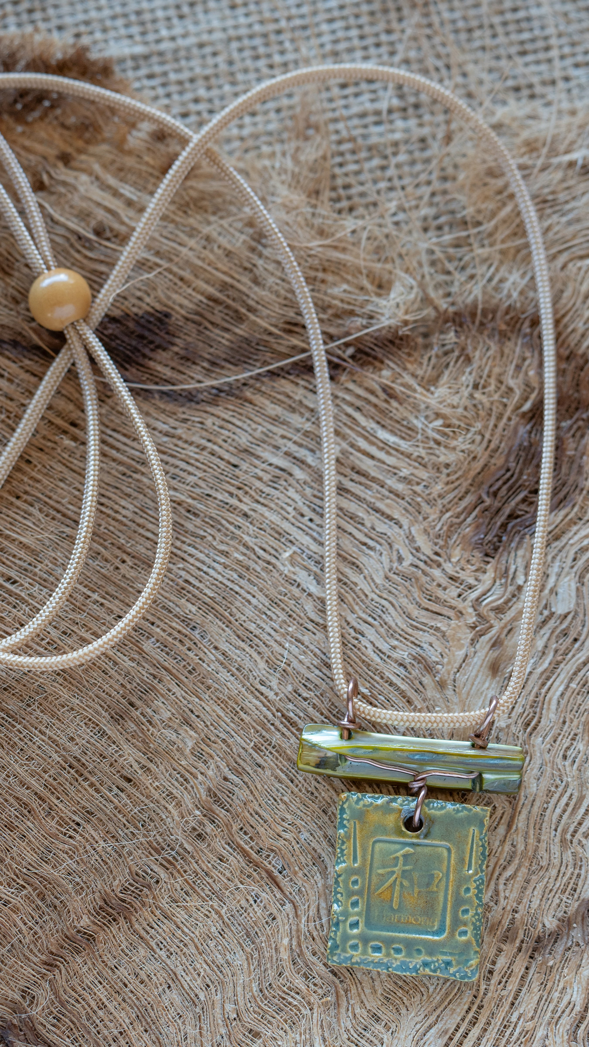    Island-Inspired Ceramic Circle Pendant