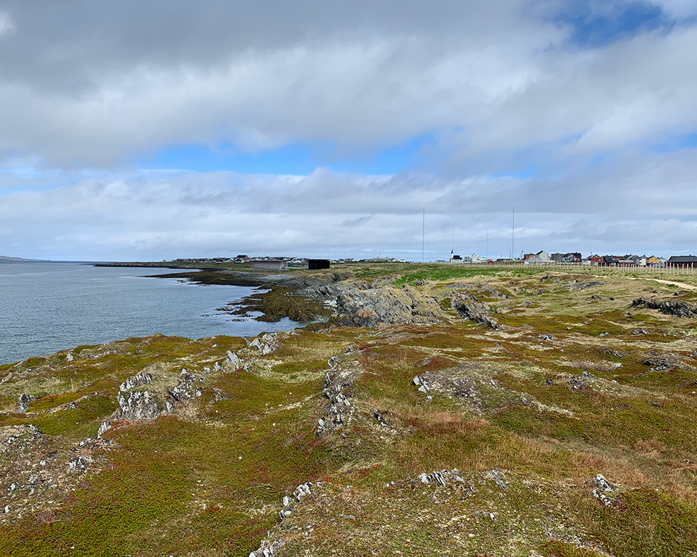 execution site of the withc trial by fire at the stake in Vardo, Norway with Steilneset Minnested in the background along the coastline of the Barents Sea