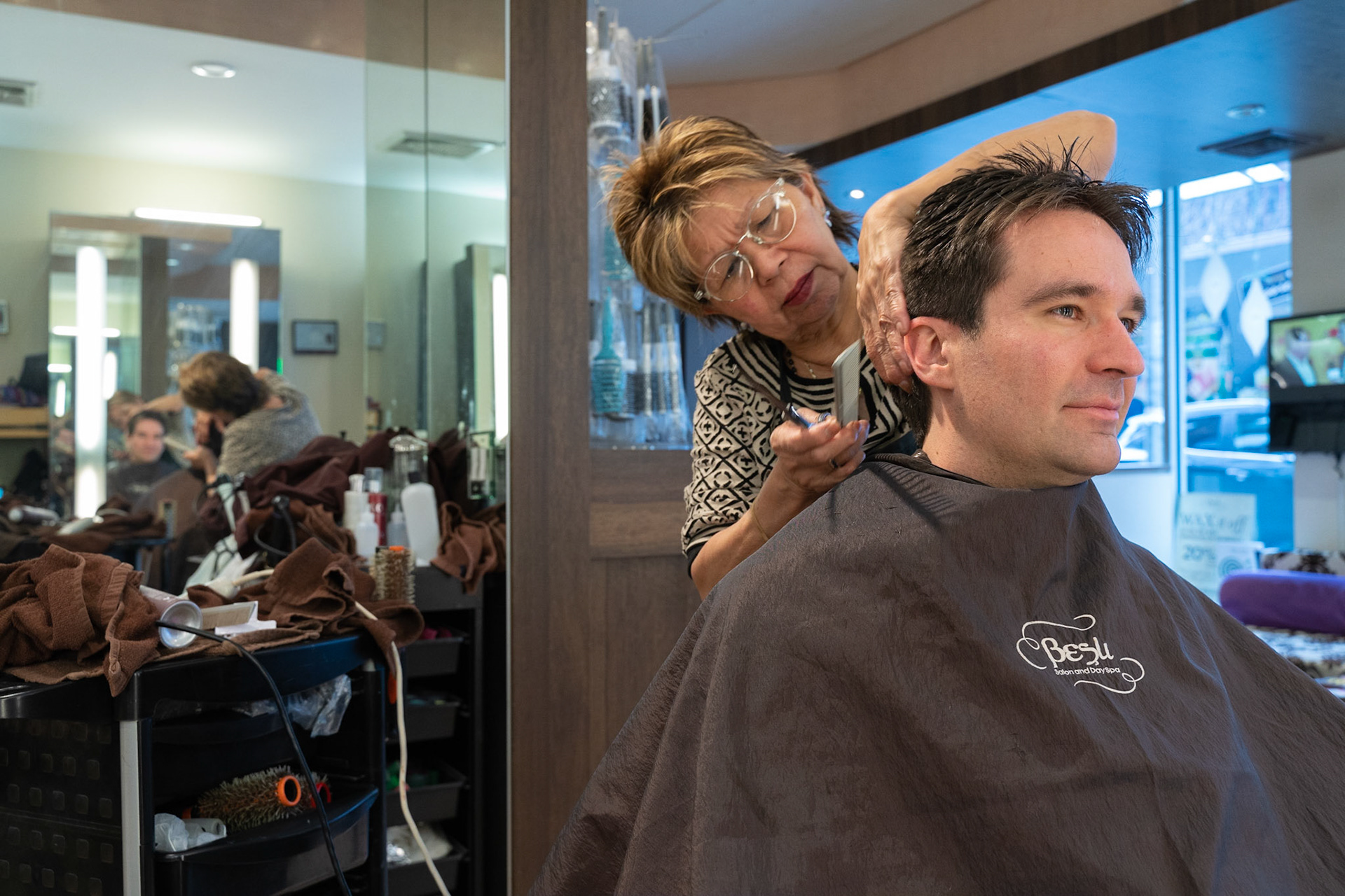 Josh gets a hair cut with Shirley. She declines a phone call, she's "with the Rabbi!"