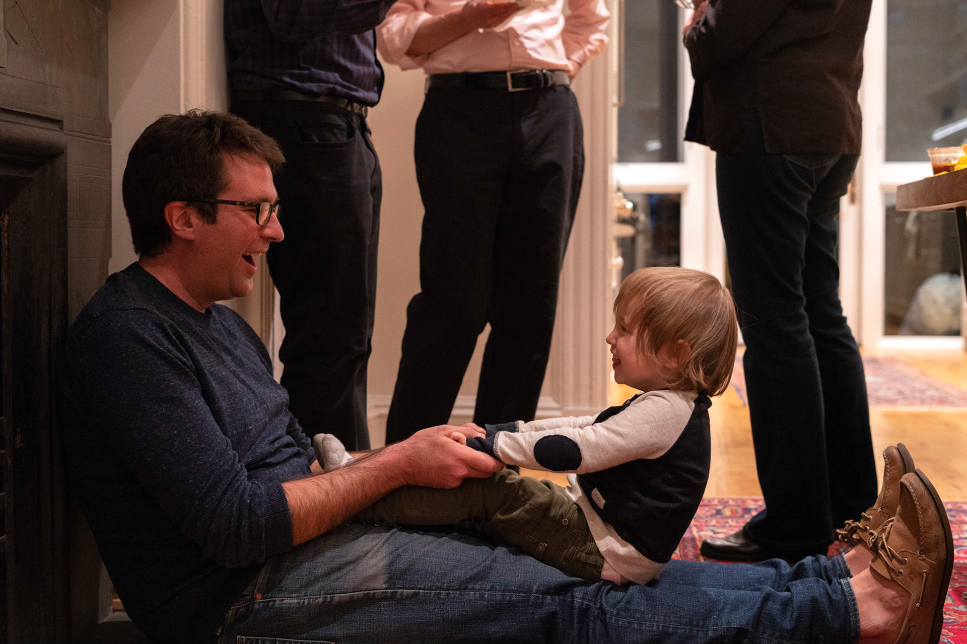 Josh practices for fatherhood with a friend's son.