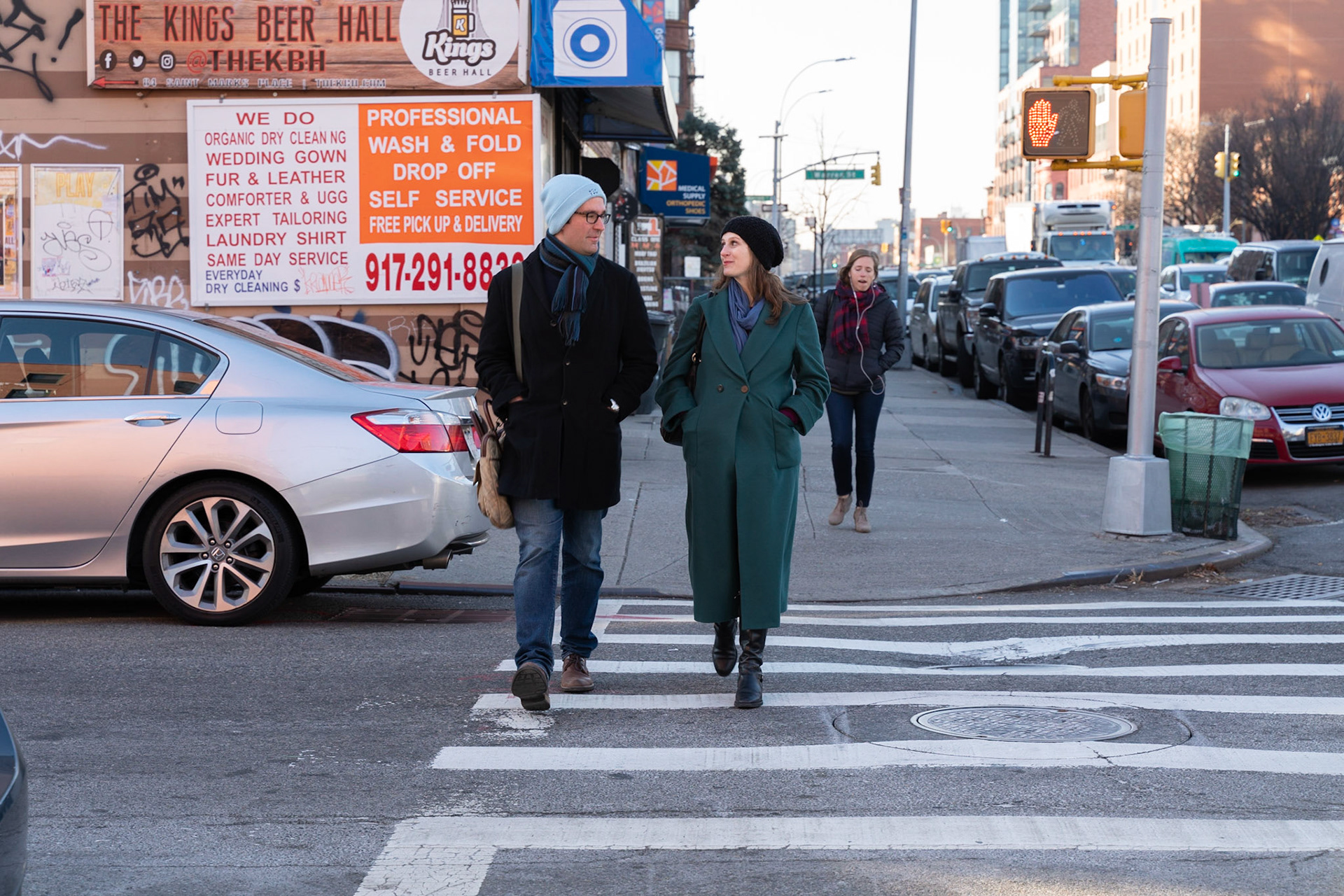 Josh walking to the subway with his wife, Mirah.