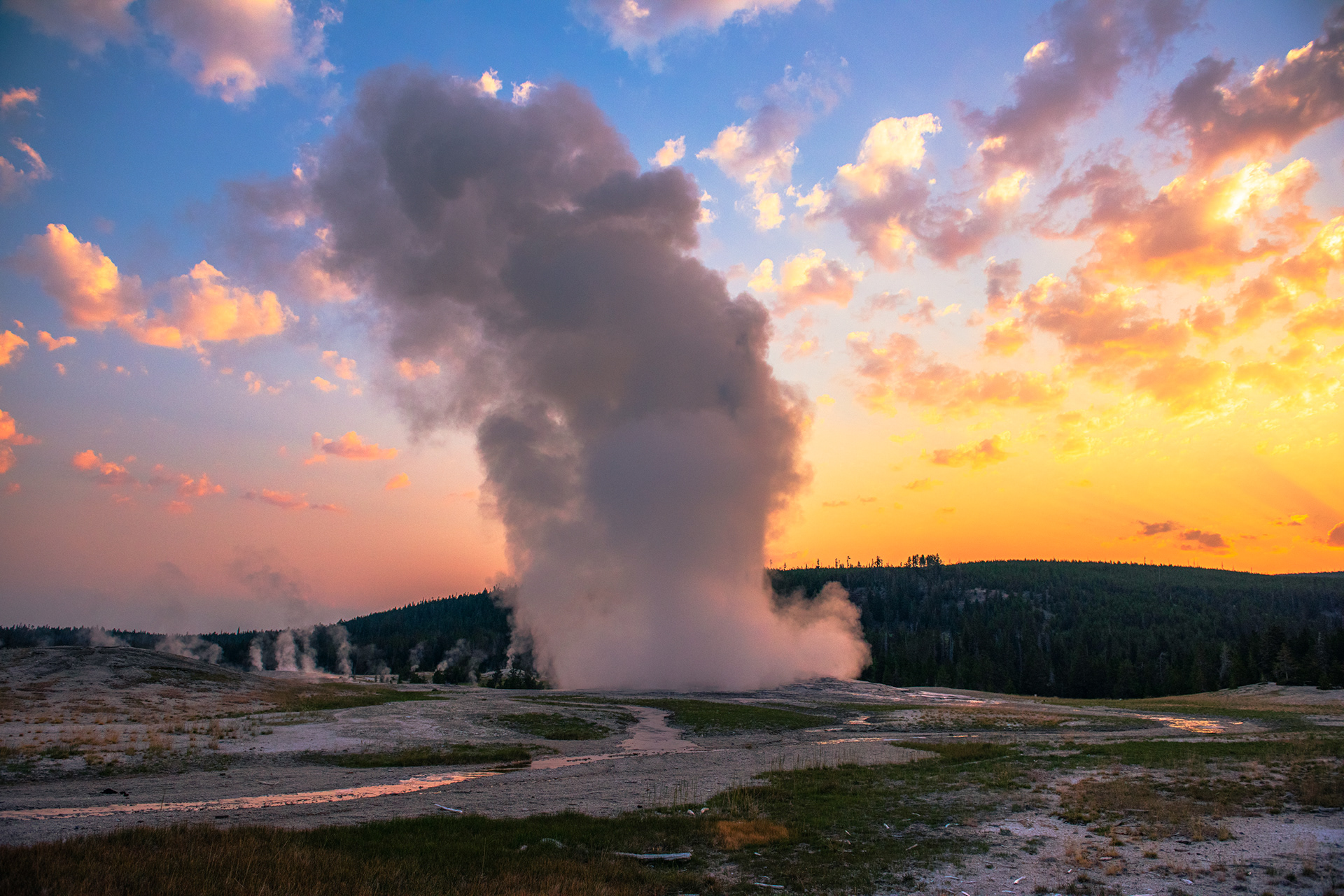Old Faithful Geyser Eruption at Sunrise