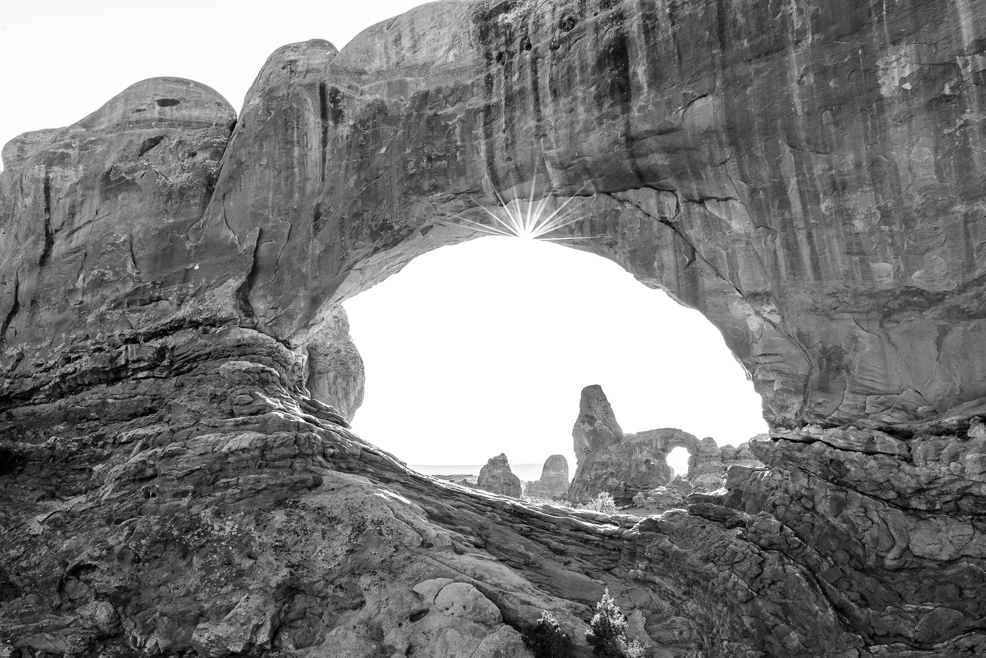 Two Arches with Sun Star