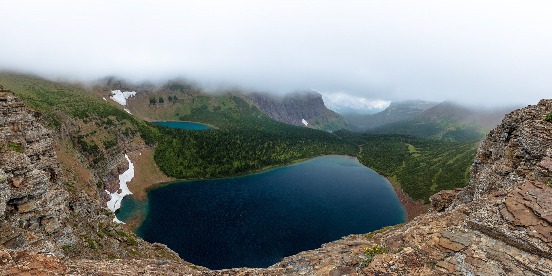 Overlooking Two Alpine Lakes on a Foggy, Windy Day in Montana