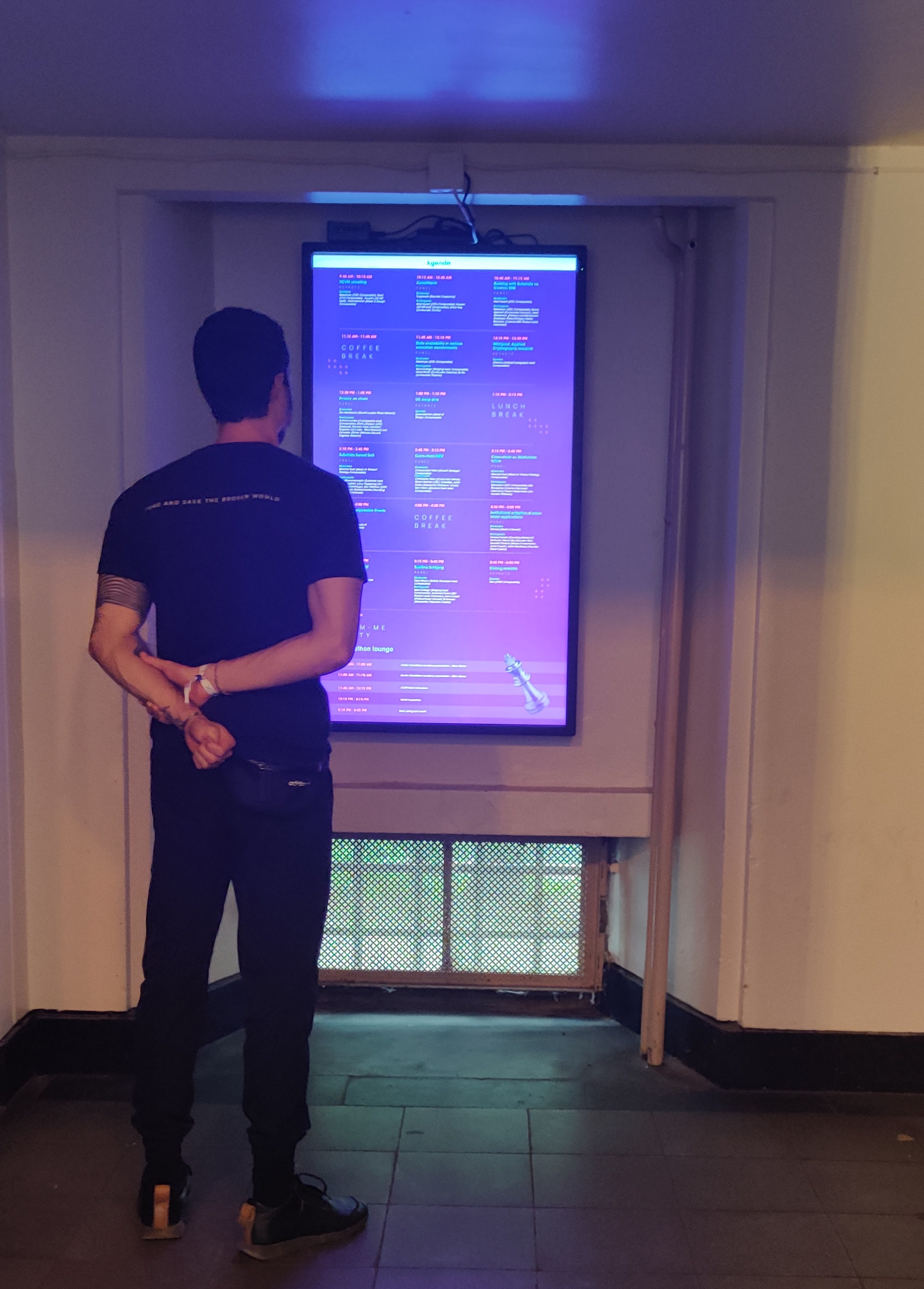 A visitor checking out the schedule