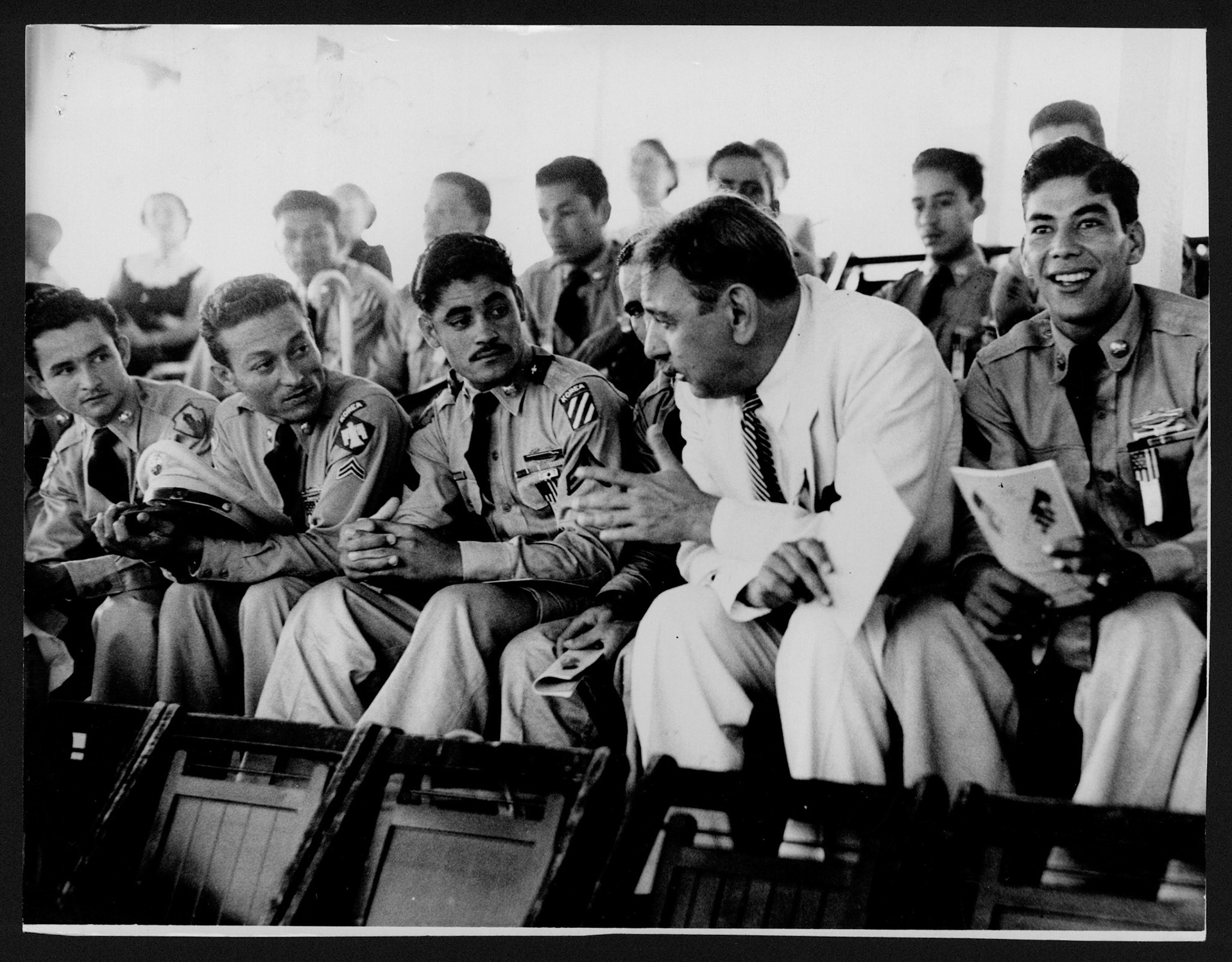 Veteranos de la guerra de Corea junto a Luis Muñoz Marín presenciando el desfile del 4 de julio.San Juan.Julio 4, 1953
