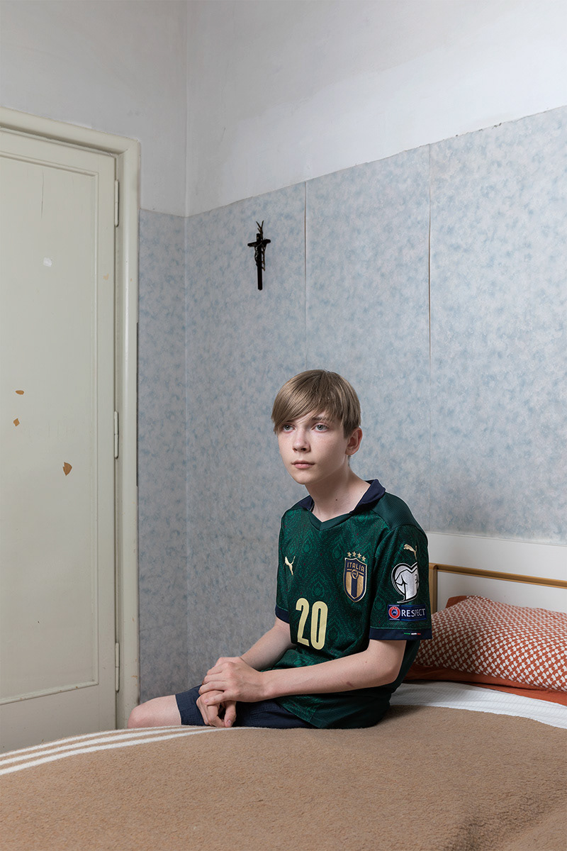 Fiuggi (FR), Italy. 1 June 2022. Rostyslav MelnyK, 13, portrayed in the First Reception House provided by Caritas / diocese of Anagni and Alatri to him and his family. Rostyslav comes from Korostyshiv, in the Zhytomyrska region, together with his mother Alla, his sister Oksana and her son Mark. Alla owns a homeware shop, while Oksana works with her husband in a granite quarry. Rostyslav was in the seventh year of school (equivalent to our second grade). On February 25, the whole family moved into Oksana's apartment. They remained there until March 5, descending into the underground shelter at each alarm. On 6 March at 6 am, their husbands drive them to Berehove, on the border with Hungary, where they arrived after 14 hours of travel. From there they took a bus paid for by a Ukrainian citizen who had been living in Fiuggi for 20 years, who also put them in contact with the head of Caritas. They arrived in Italy on the night between 7 and 8 March, after 25 hours of travel. On June 5, 2022, they returned to Ukraine out of nostalgia for the family who remained in the country and to resume their work activities.