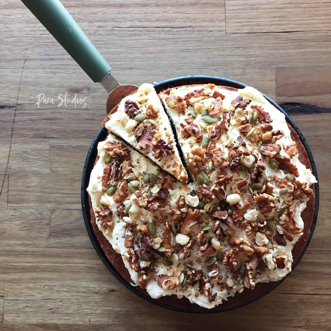 Carrot cake with cream cheese, pepita seeds and walnuts