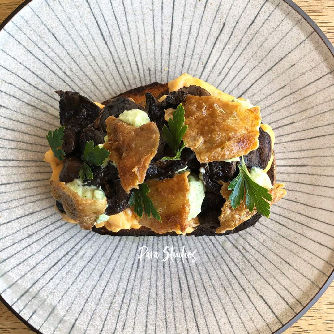 Mushrooms, miso butter, scrambled eggs, pesto, ricotta and crispy chicken skins
