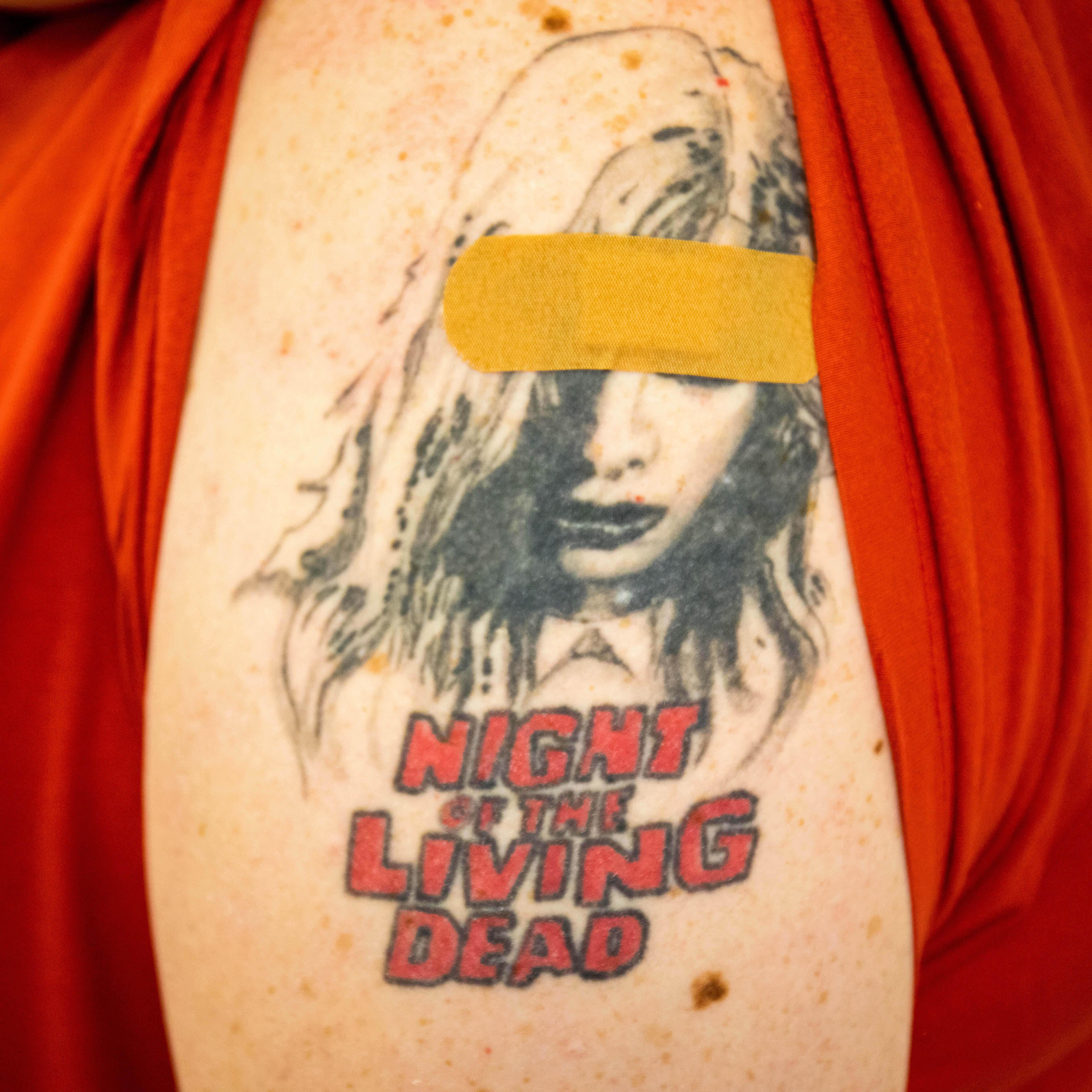 George Burkholder, a resident at Ruoff Tower Apartments in Lancaster, Pa., got his first shot of the Moderna vaccine right through his "Night of the Living Dead" tattoo, Mar. 22, 2021.