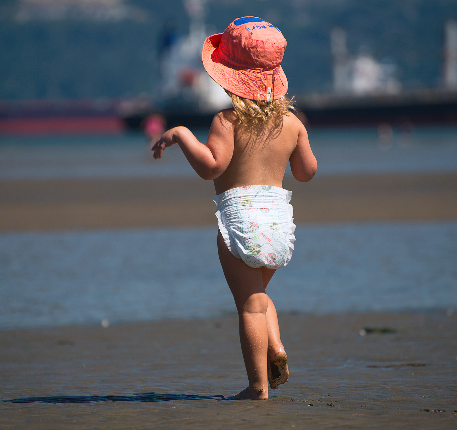 Tiny dancer.... girl in diapers at the beach