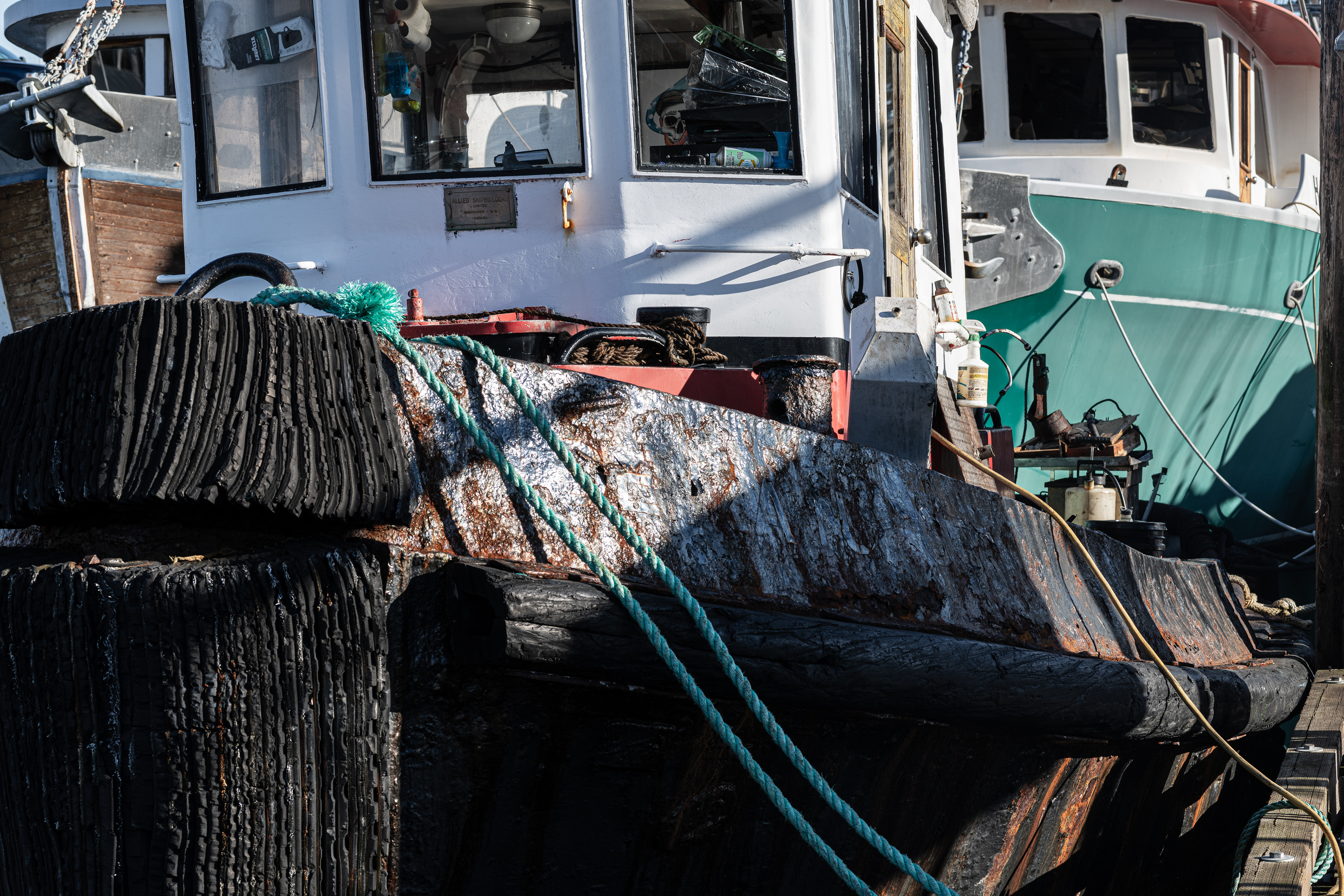 Closeup of the rusted bow plates of an old steel tugboat