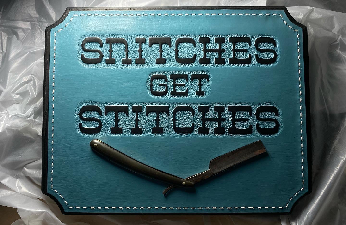 Carved Leather on wood plaque with straight razor for Tattoo Charity  Benefit