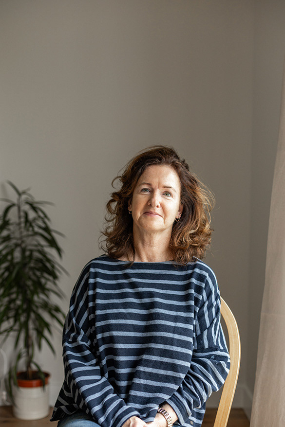 Portrait of woman in striped jumper using natural light