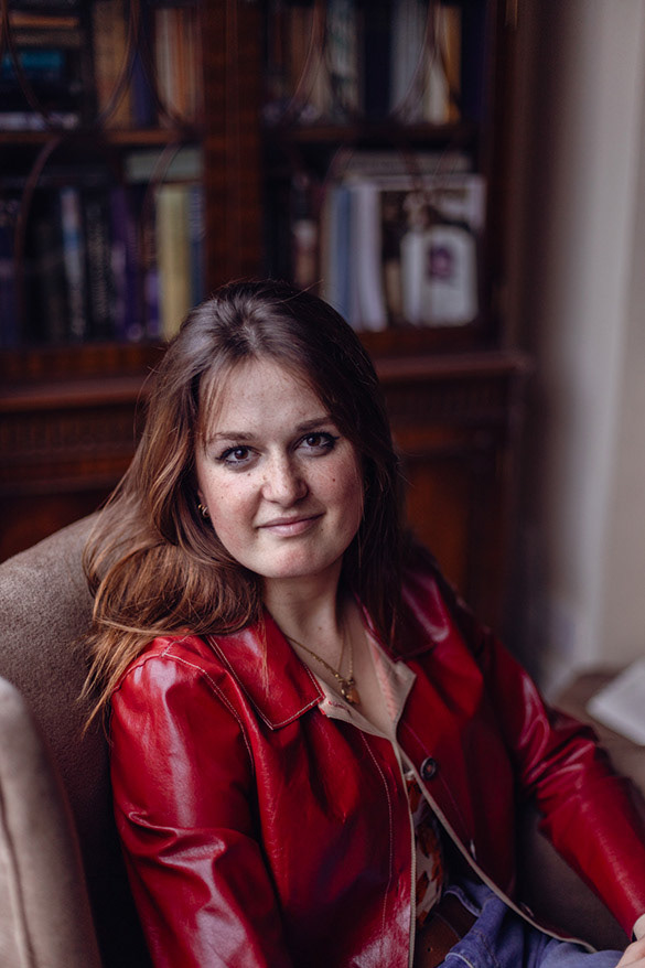Portrait of young woman in red leather jacket
