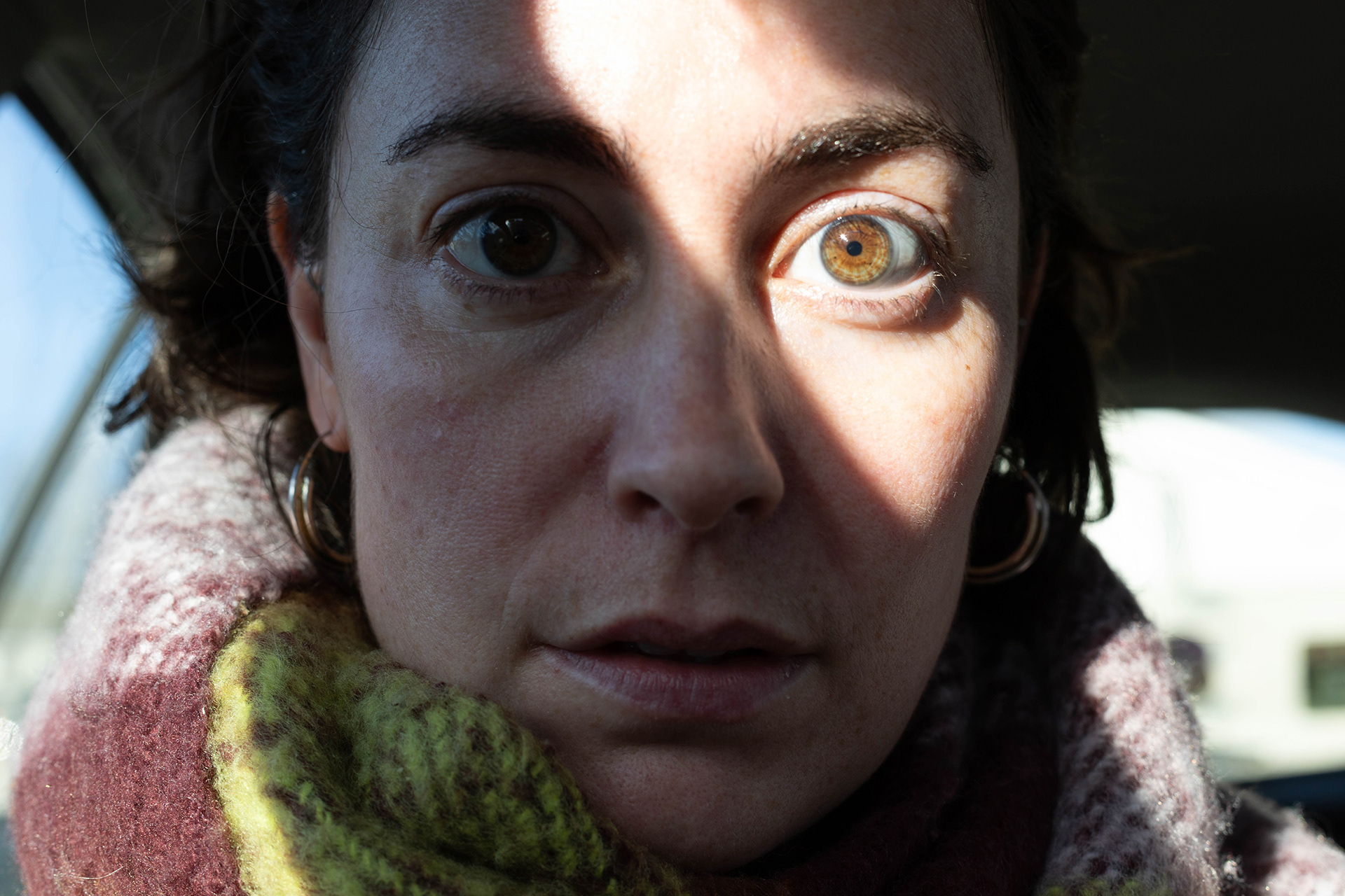 Self portrait close up with sunlight highlighting one eye