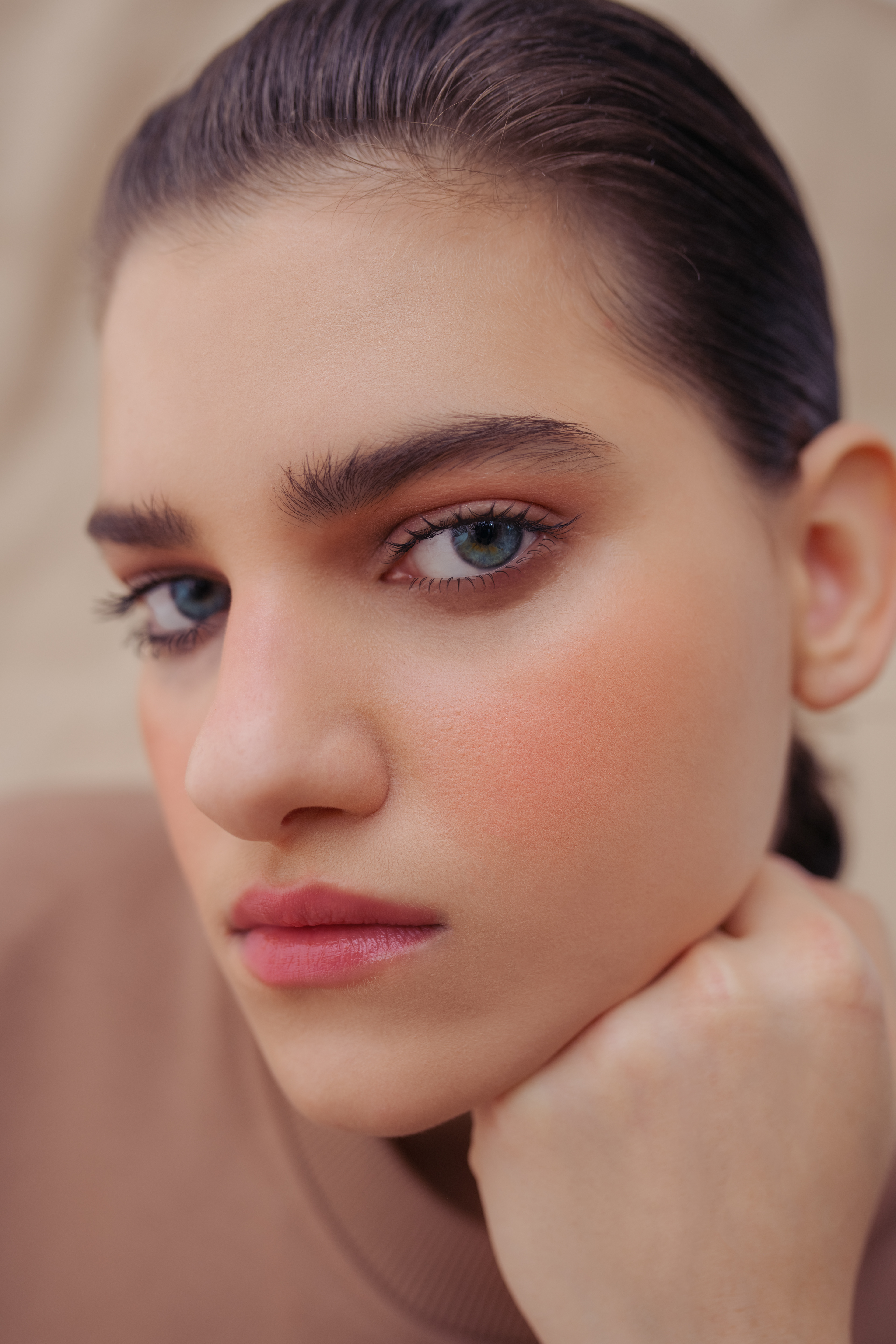 soft makeup with popping blue eyes.