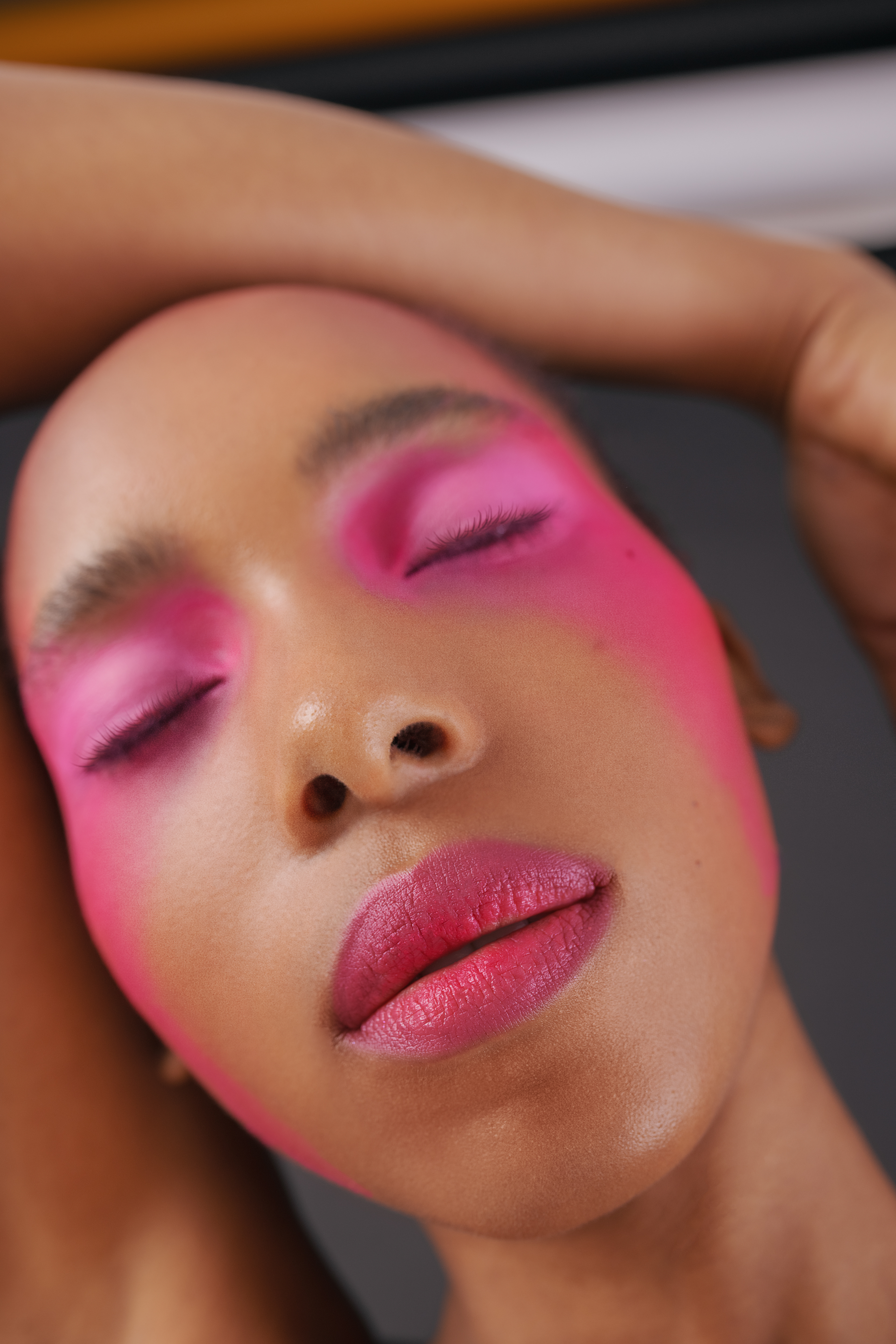 shot of a woman wearing pink bubblegum makeup.