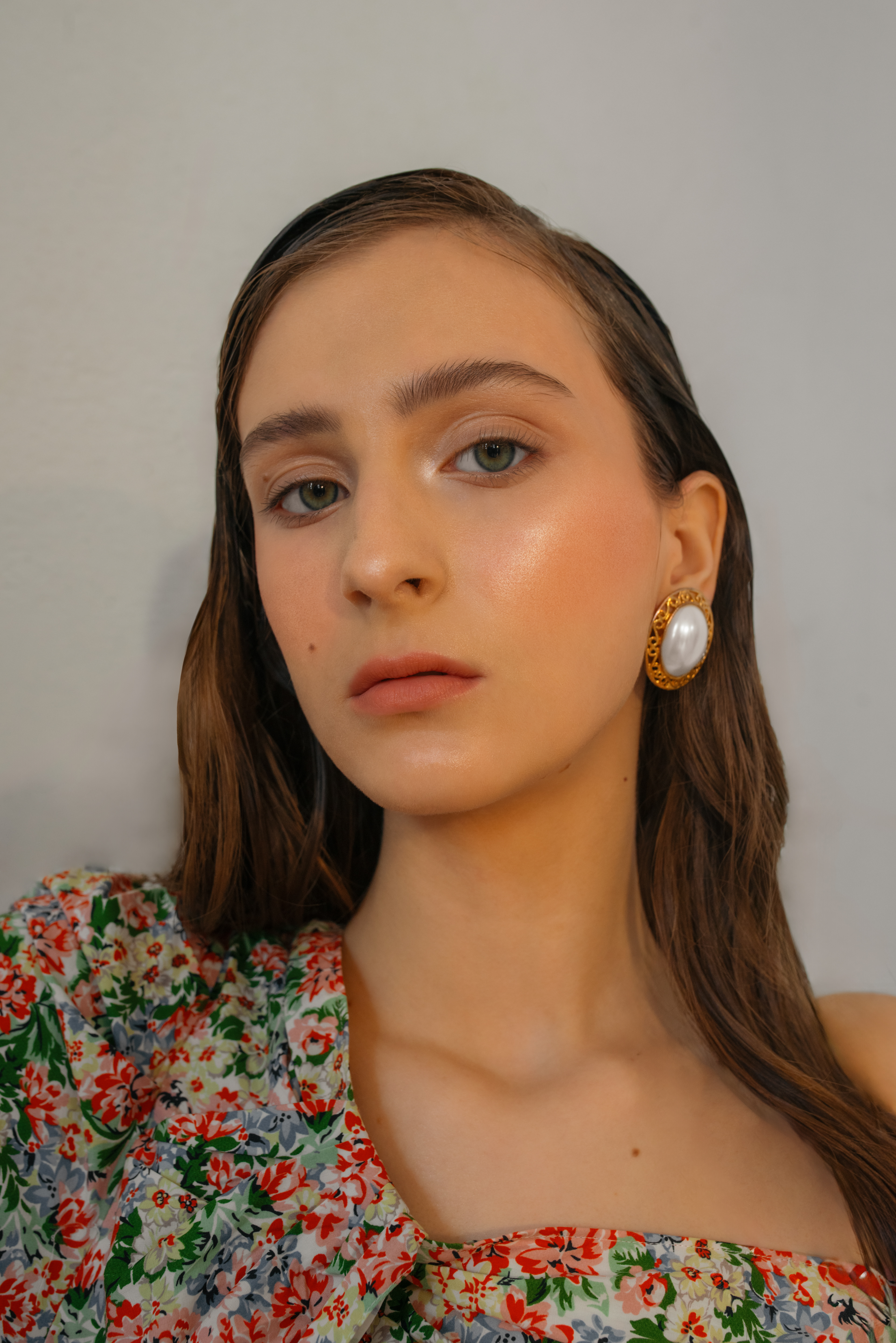 headshot showcasing glam makeup and jewelry