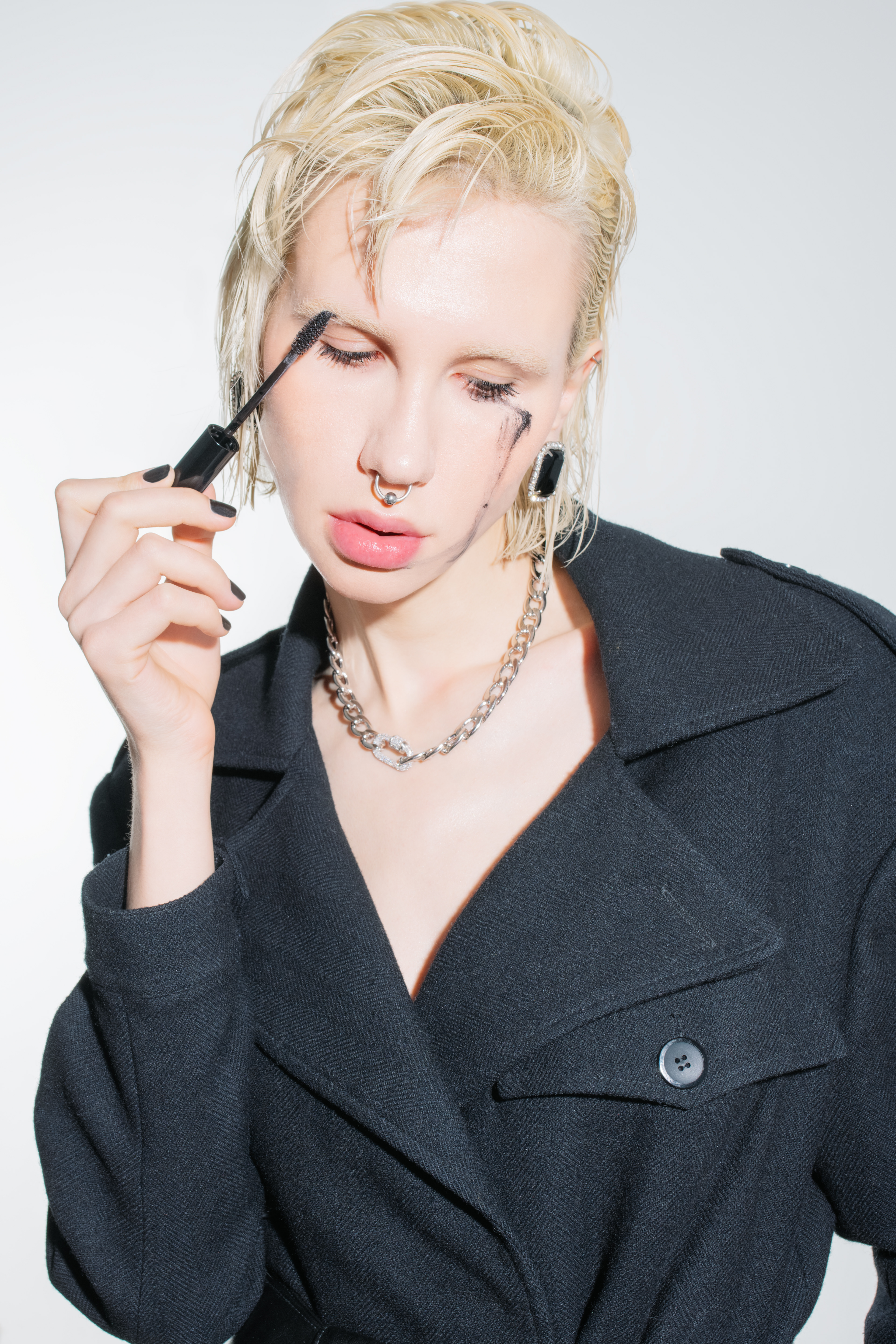 shot of a woman advertising black mascara