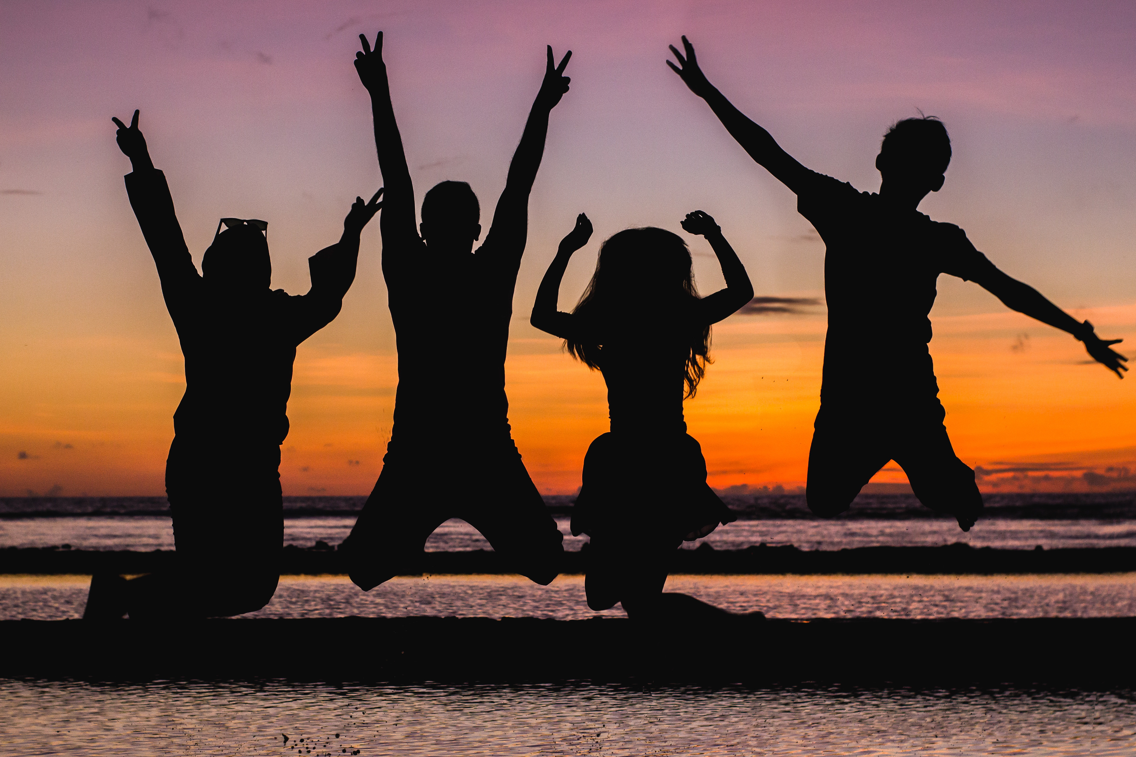 Photo by vjapratama from Pexels: https://www.pexels.com/photo/silhouette-of-people-jumping-935835/