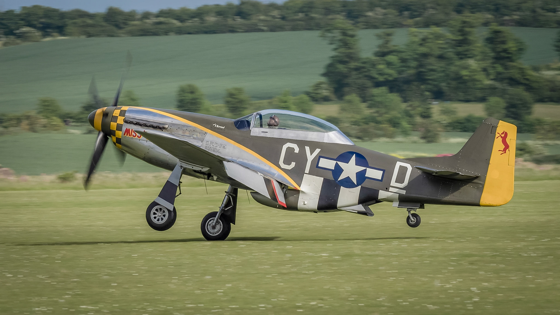 Duxford, UK - May 23rd 2015: A vintage US P51 Mustang aircraft, flying at Duxford VE Day Airshow
