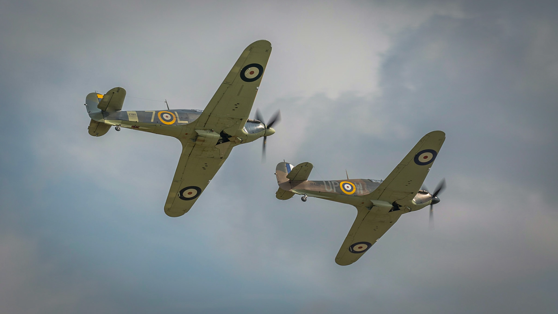 Biggleswade, UK - 7th May 2017: Pair of vintage British   Hurricane fighters in flight