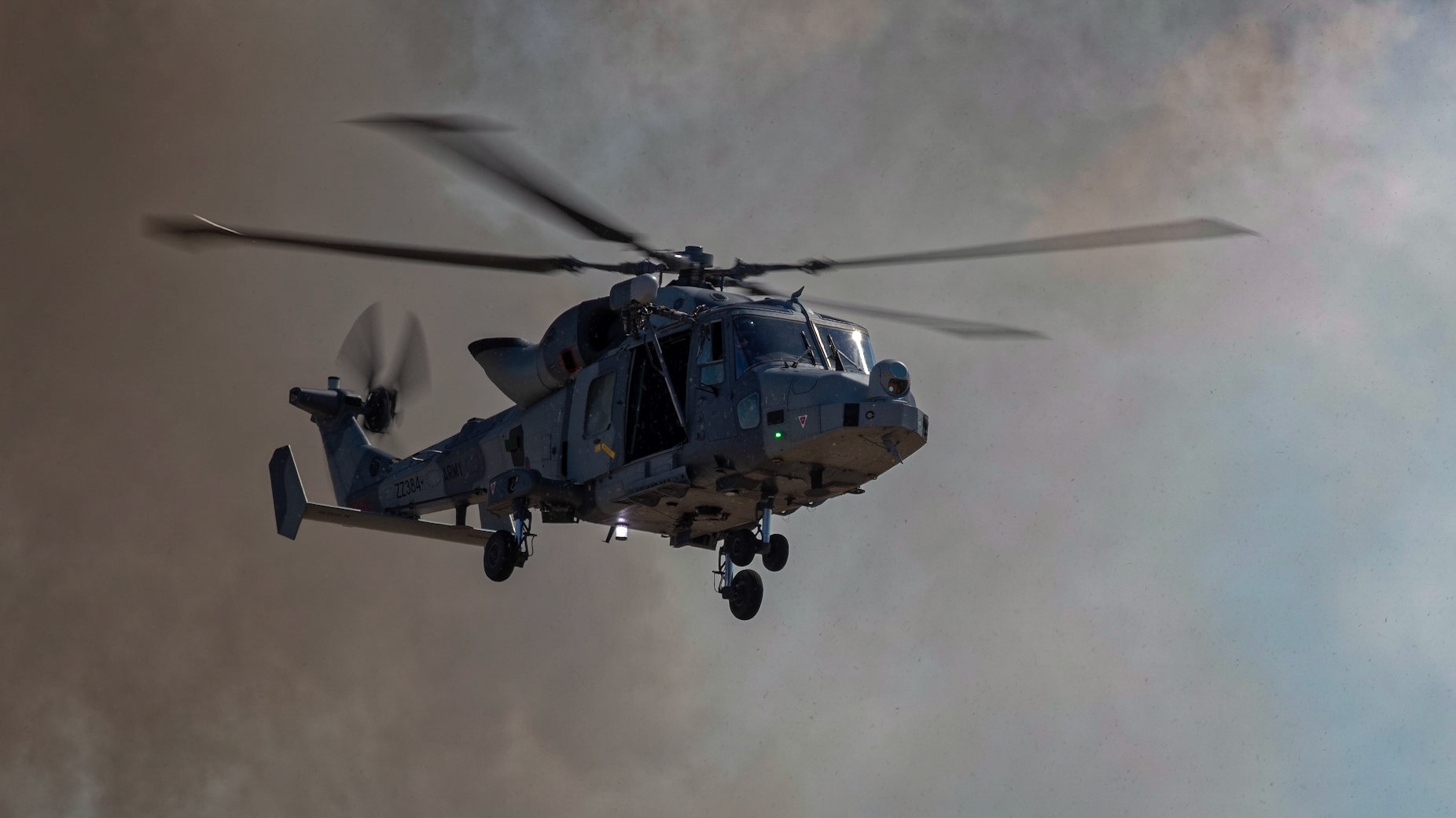 Yeovilton, UK - 7th July 2018: A Royal Navy Lynx HMA.8  helicopter in flight approaching airfield