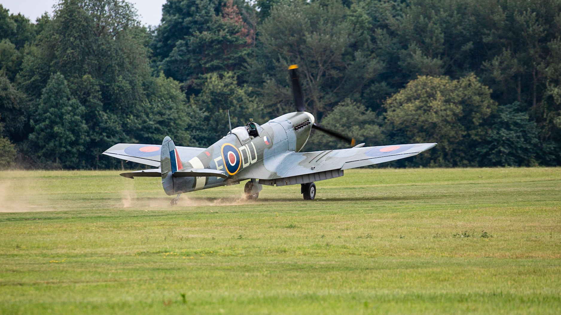 Old Warden, UK - 4th August 2019: A vintage world war two British Spitfire fighter plane landing on airfileld
