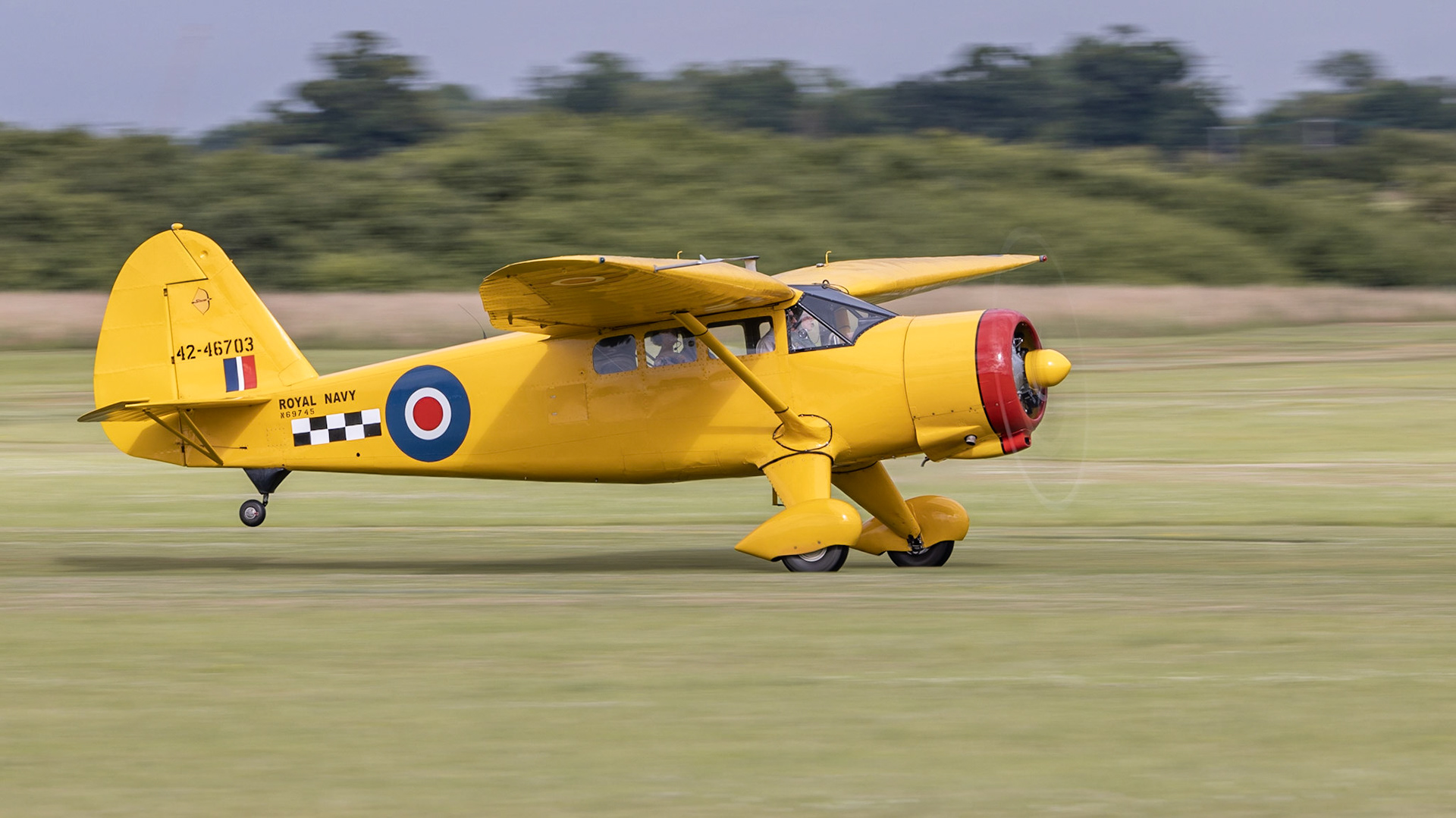Old Warden, UK - 3rd July 2022: A vintage Stinson Reliant 1 aircraft landing on grass